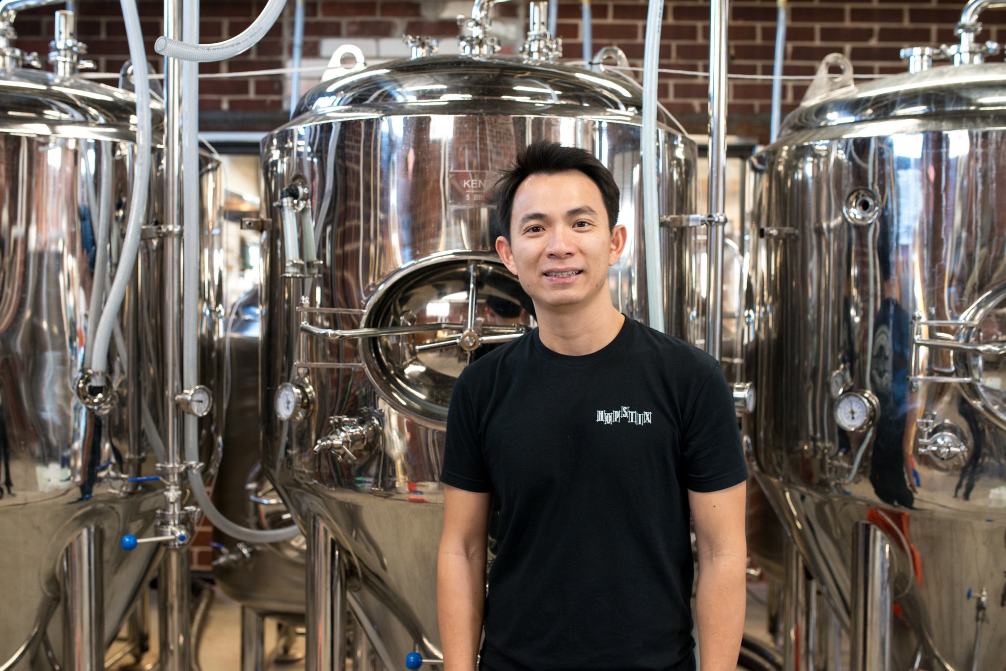 Hopstix founder and brewmaster Andy Tan in the restaurant's brewery. Photo credit- Mia Yakel.