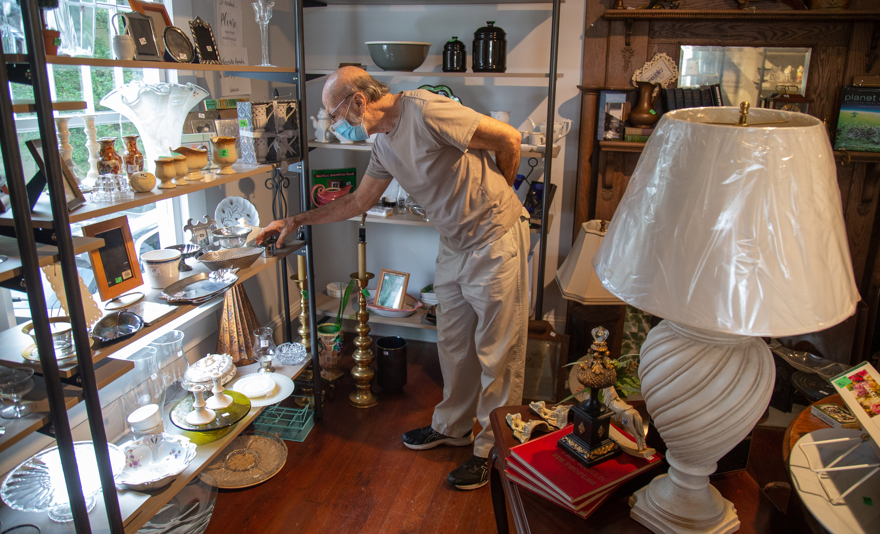 Dick Littafied looks over the merchandise at the Giving Tree Thrift Store in Chamblee Saturday, October 24, 2020. STEVE SCHAEFER / SPECIAL TO THE AJC