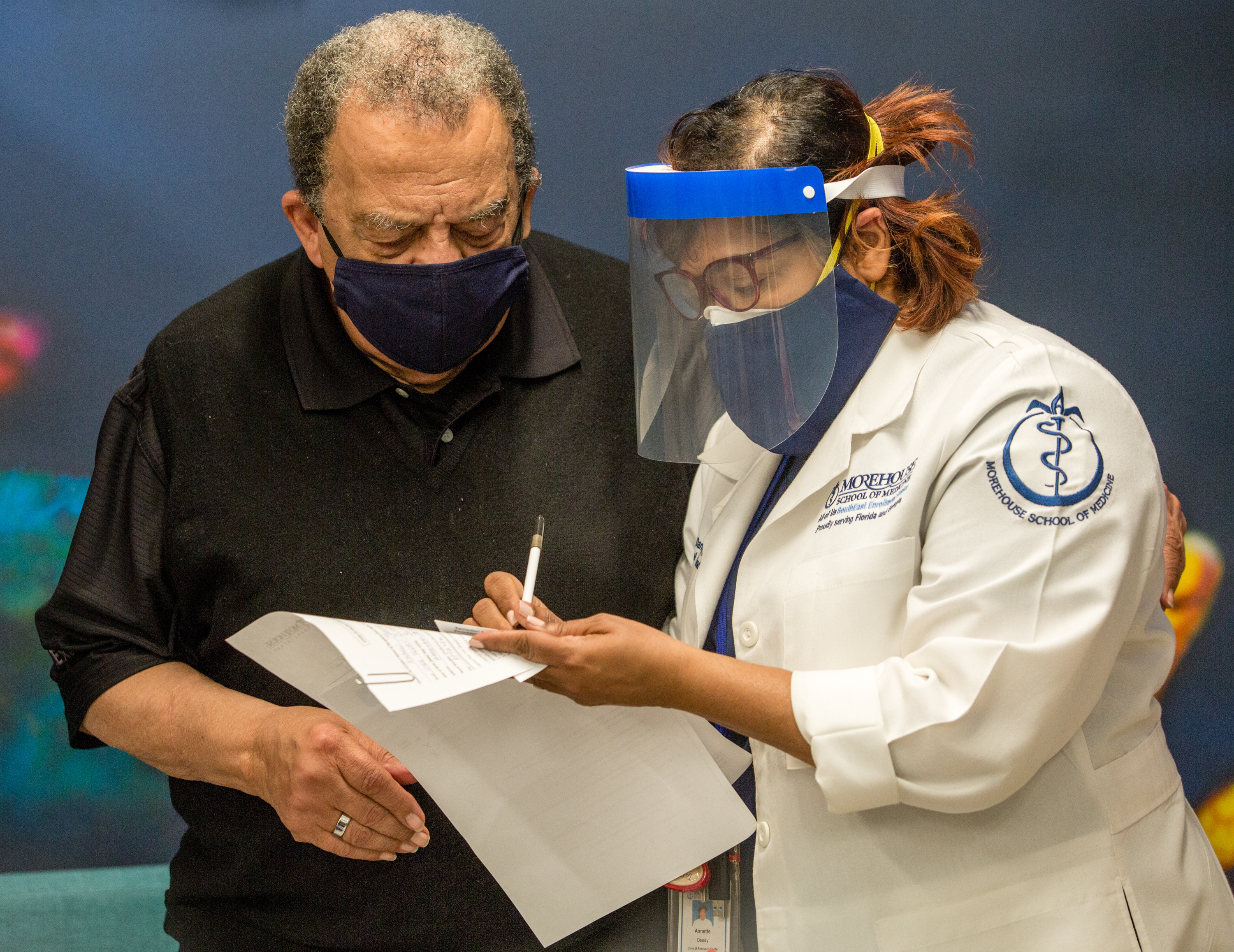 Morehouse School of Medicine on Jan. 5 administers the first of two Moderna Covid-19 vaccines to civil rights leaders including Ambassador Andrew Young and sets up reminders for the second dose. (Jenni Girtman for The Atlanta Journal-Constitution)