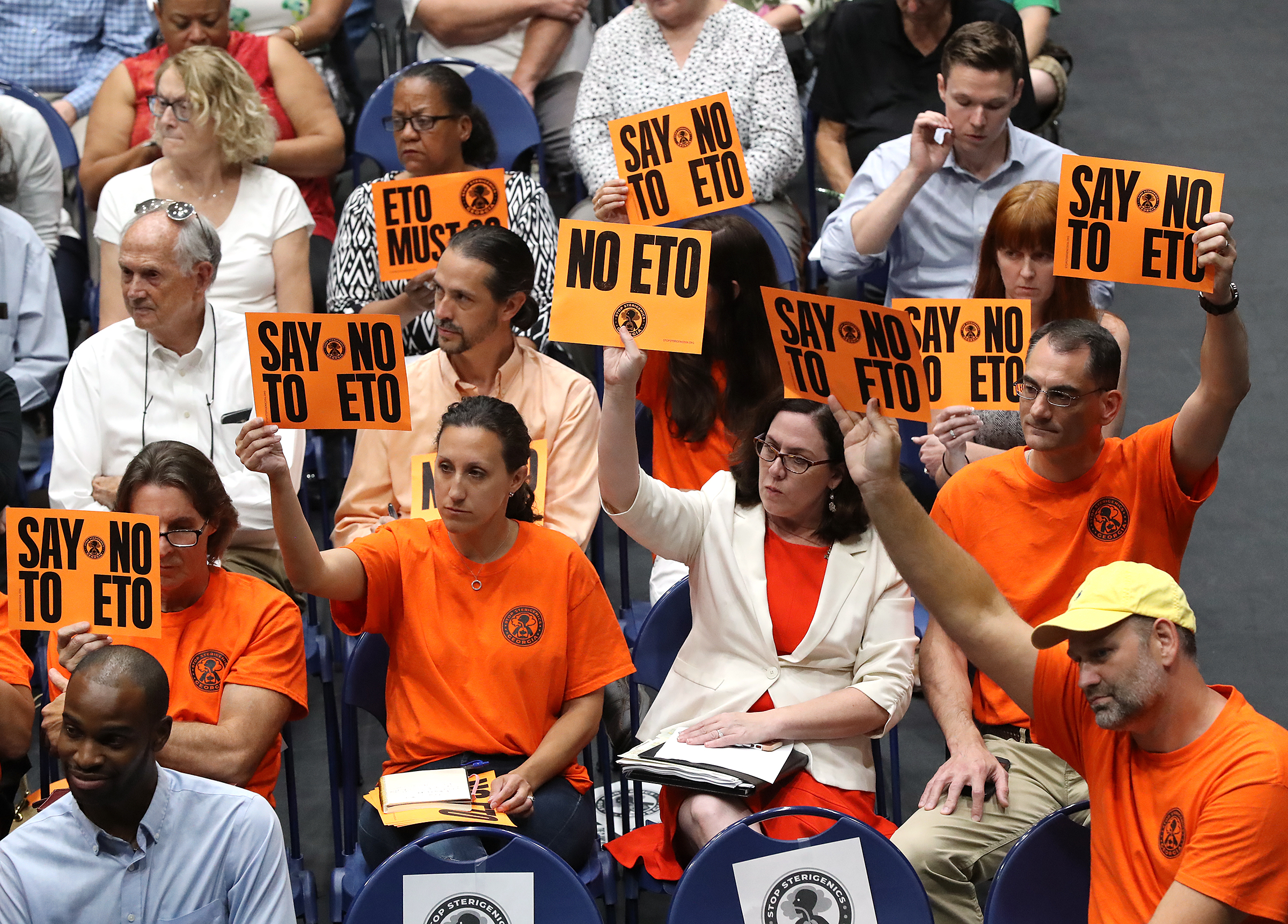 August 19, 2019 Marietta: Many area residents hold signs in opposition as Cobb officials and environmental regulators hold a town hall and community forum in the wake of reports that Cobb and Fulton have high levels of carcinogenic gas on Monday, August 19, 2019, in Marietta. A user and emitter of the gas, Sterigenics, which sterilizes medical equipment, operates in the area. Curtis Compton/ccompton@ajc.com
