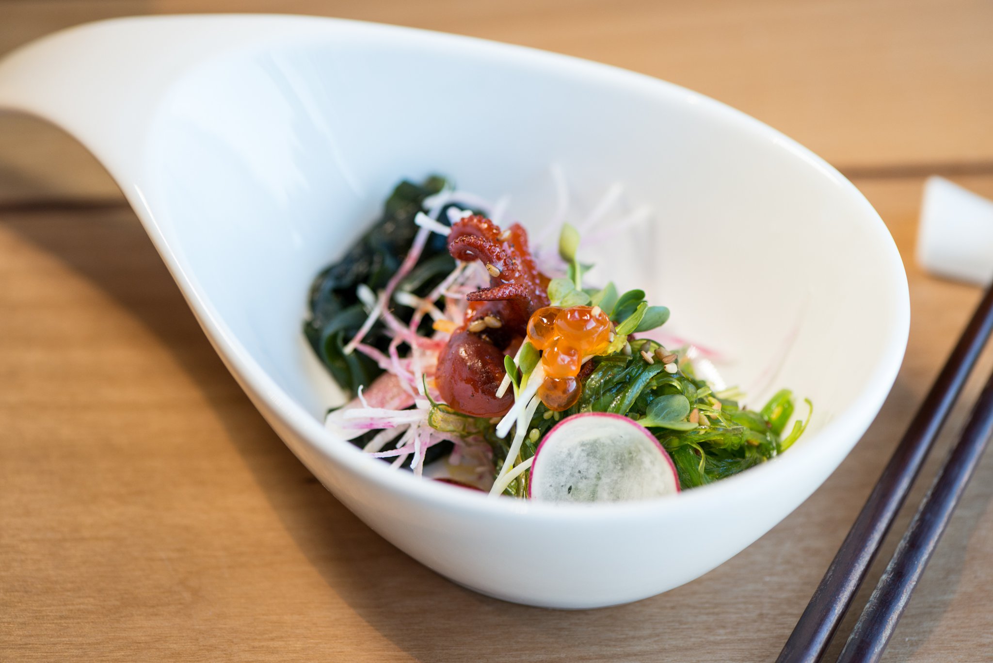 Hopstix Seaweed salad with masago, watermelon radish, and baby octopus. Photo credit- Mia Yakel.