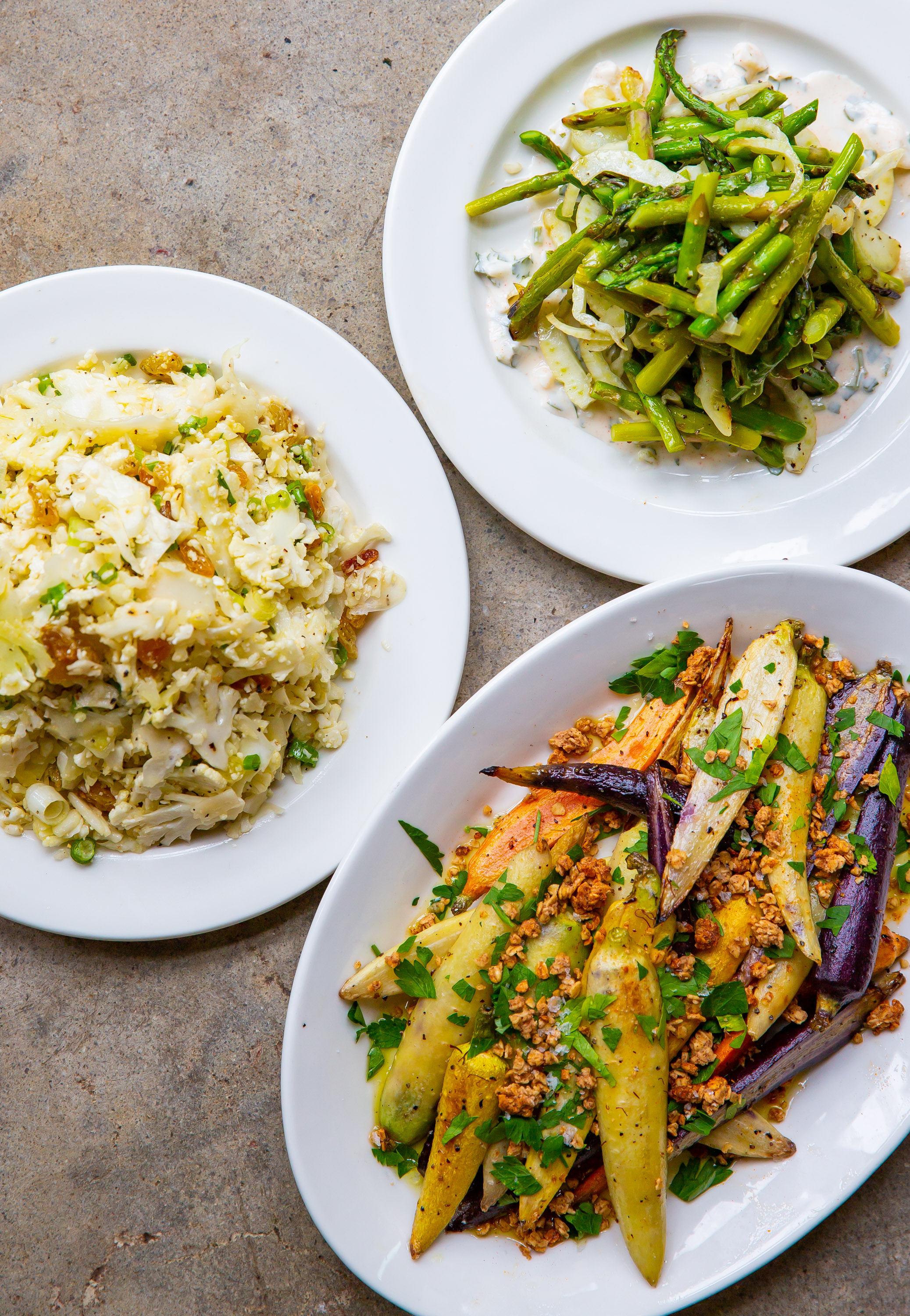 Among Adele's vegetable dishes are (clockwise from left) cauliflower salad, fried asparagus with lemon yoghurt dressing, and charred heirloom carrots with spicy granola.  Ryan Fleisher for The Atlanta Journal-Constitution
