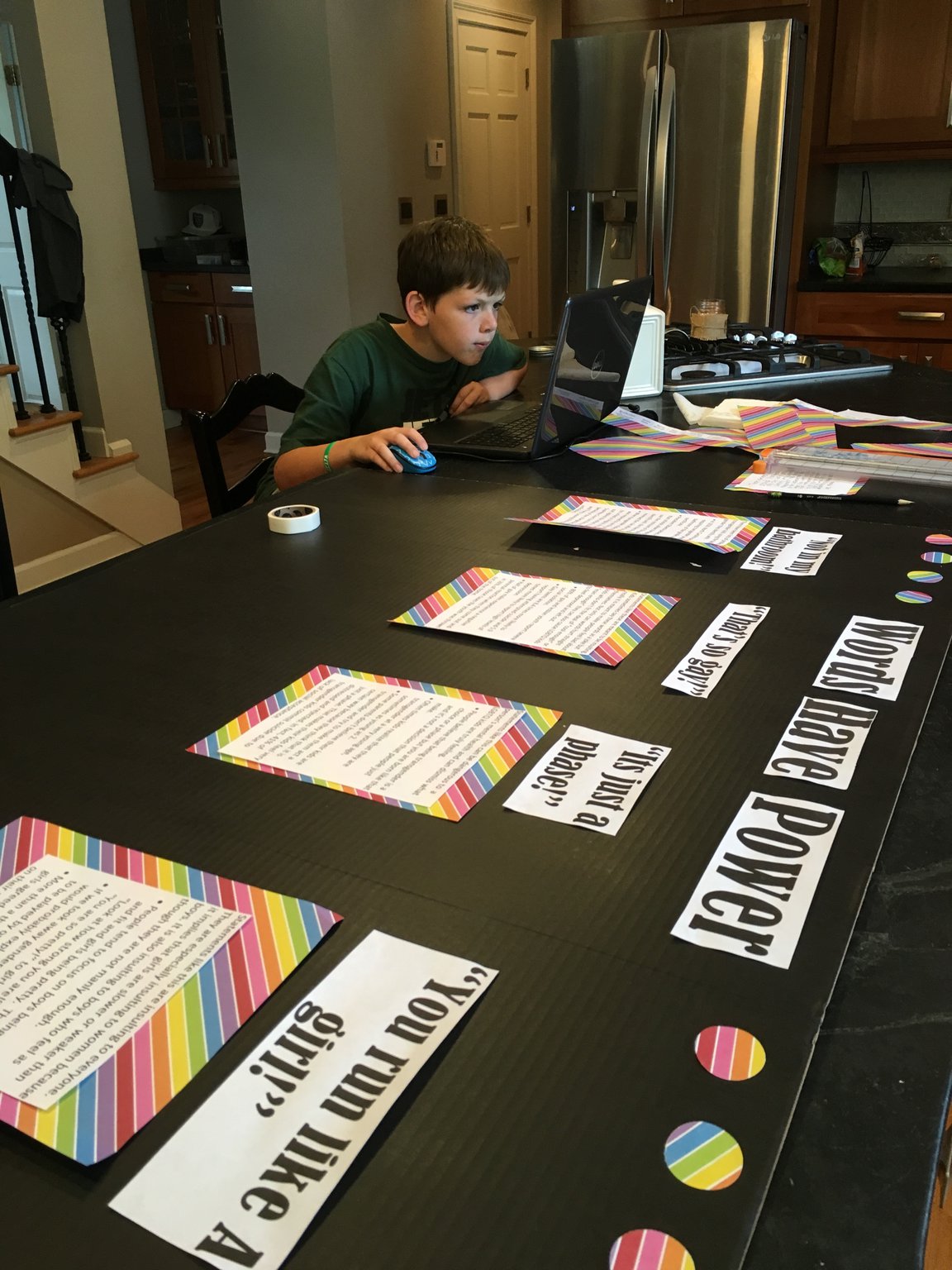 Bennett Stone, 10, shown working on a class project to show transgender individuals that their lives matter, is a wonderful example of being a good neighbor to others. He got the “love notes” idea after learning 41 percent of transgender individuals try to kill themselves at some point in their lives. CONTRIBUTED