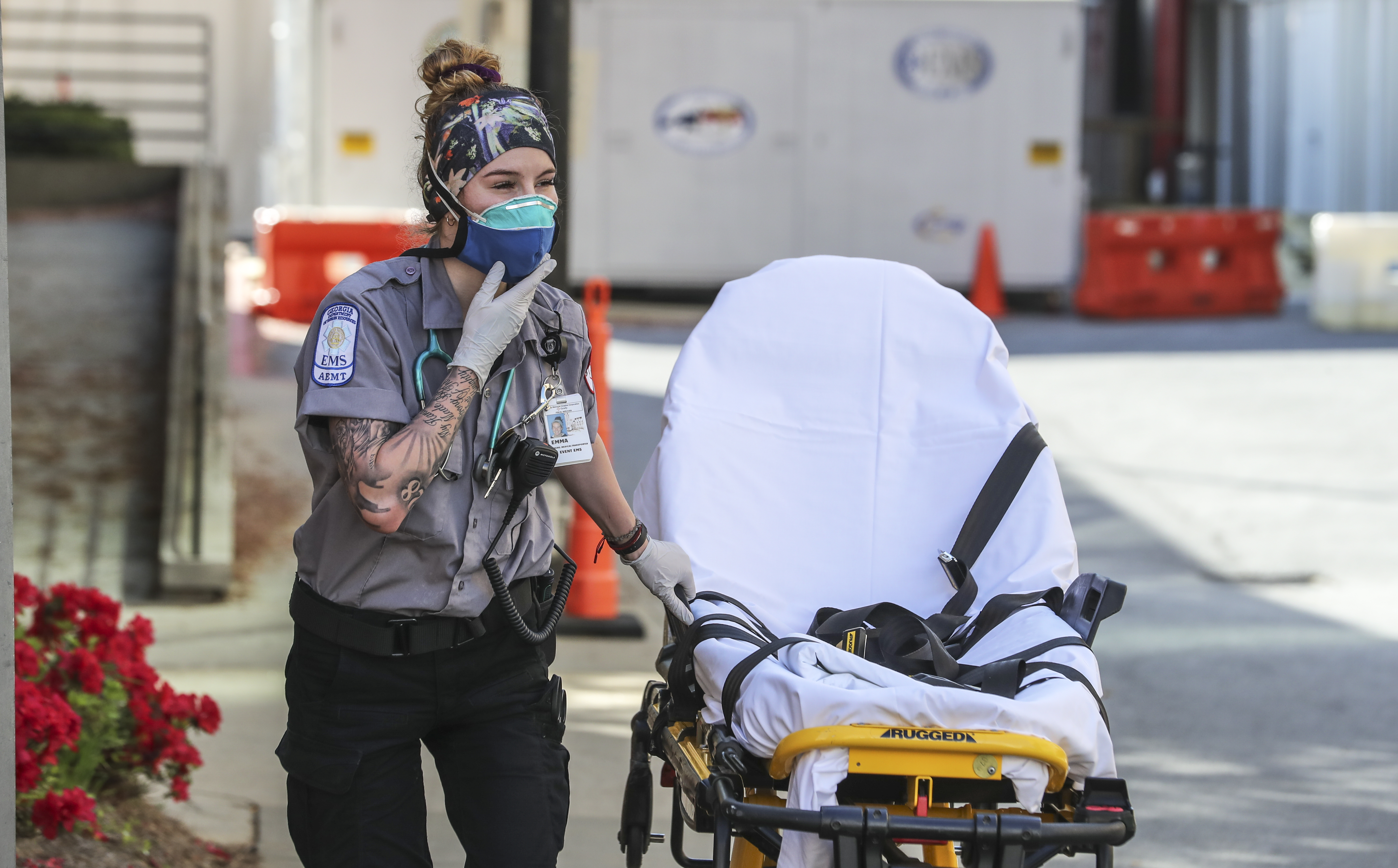 Grady Advanced EMT, Emma Hovis prepares for another patient call on Monday, March 30, 2020. First responders at Grady Hospital are on the frontline of the COVID-19 epidemic taking precautions on each call. Grady was already recovering from a broken water pipe that closed three floors of its trauma center and put a strain on the hospital’s occupancy when COVID-19 began to infect Georgians. (JOHN SPINK/JSPINK@AJC.COM)