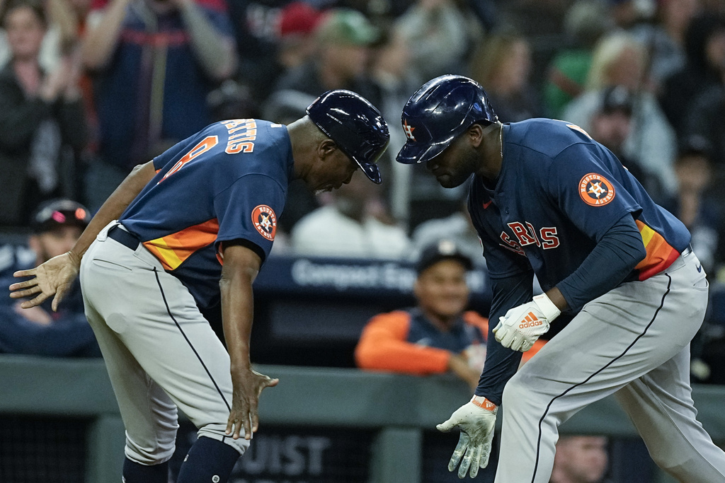 Houston Astros' Kyle Tucker is safe at second on a fielding error by  Atlanta Braves second baseman Ozzie Albies during the sixth inning in Game  2 of baseball's World Series between the