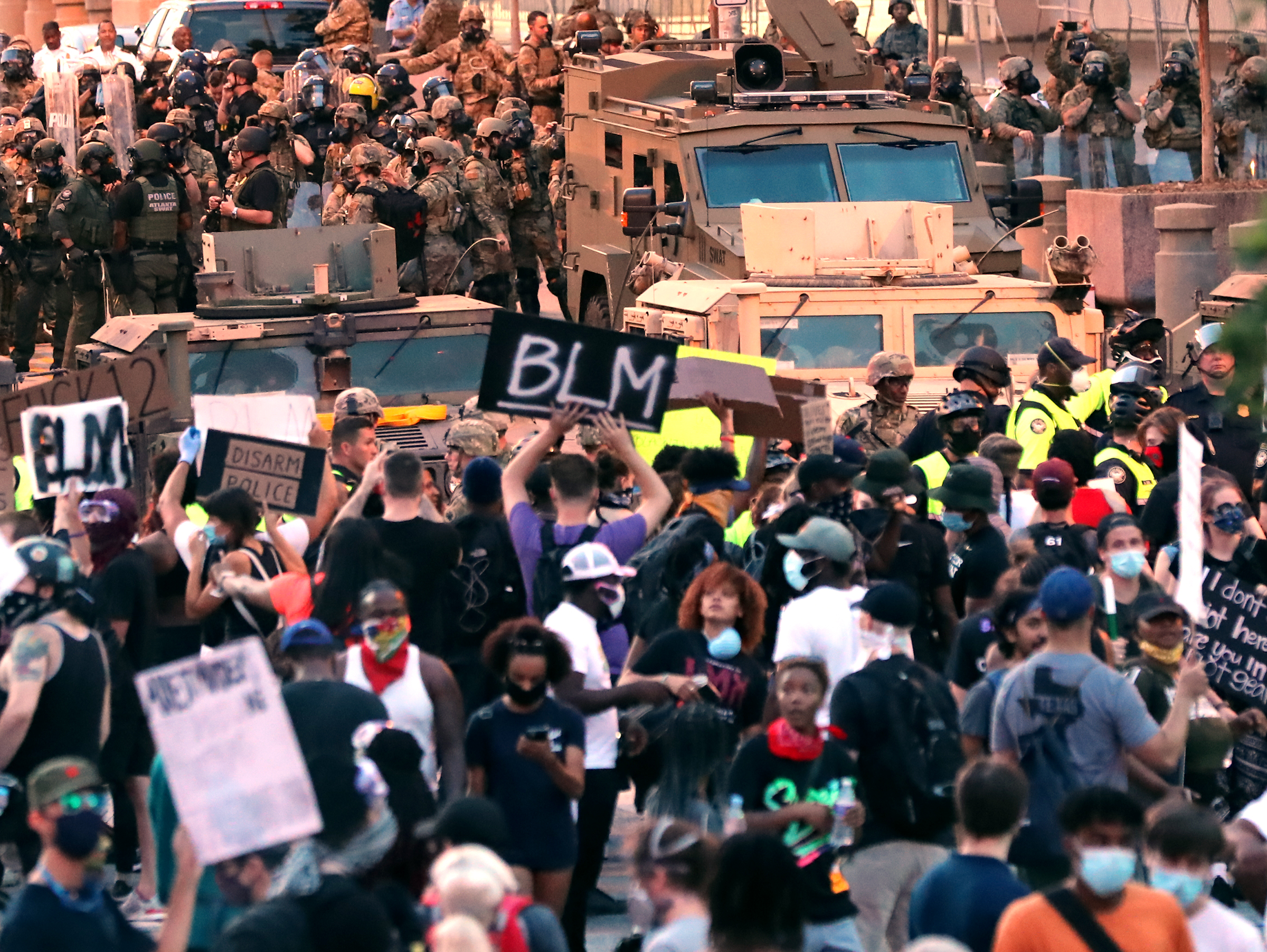 060320 Atlanta: A remnant of protesters prepare to leave peacefully as the Georgia Army National Guard moves in to enforce a 9PM curfew outside the CNN Center at Olympic Park during a sixth day of protests over the death of George Floyd in Minneapolis police custody on Wednesday, June 3, 2020, in Atlanta. Curtis Compton ccompton@ajc.com