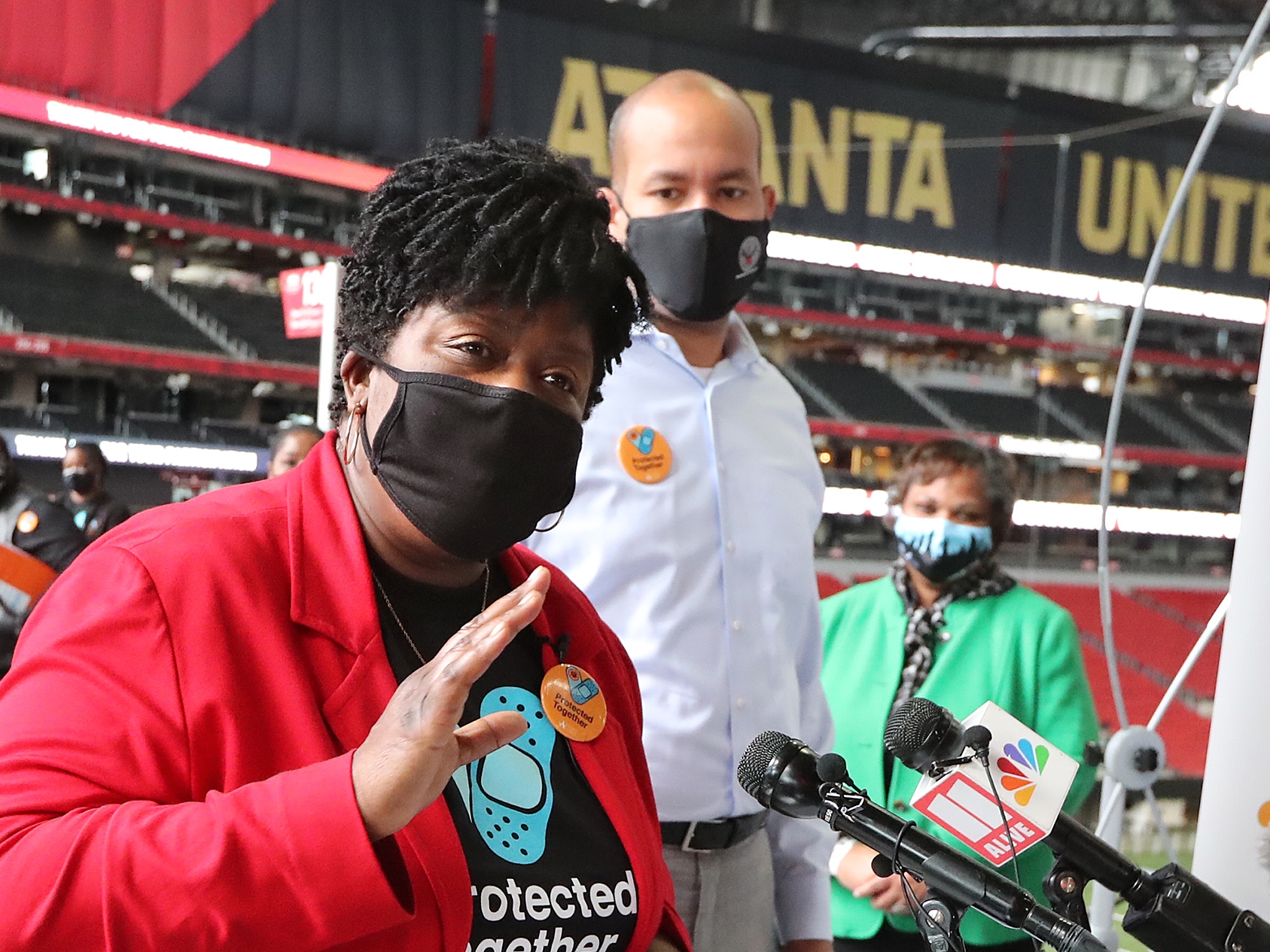032421 Atlanta: — MASS TEACHER VACCINATION — APS Superintendent Dr. Lisa Herring delivers her remarks during the APS mass teacher vaccination featuring approximately 1,200 Atlanta Public Schools (APS) teachers and staff members receiving the first of two shots of the Pfizer vaccine against COVID-19 at Mercedes-Benz Stadium on Wednesday, March 24, 2021, in Atlanta. “Curtis Compton / Curtis.Compton@ajc.com”