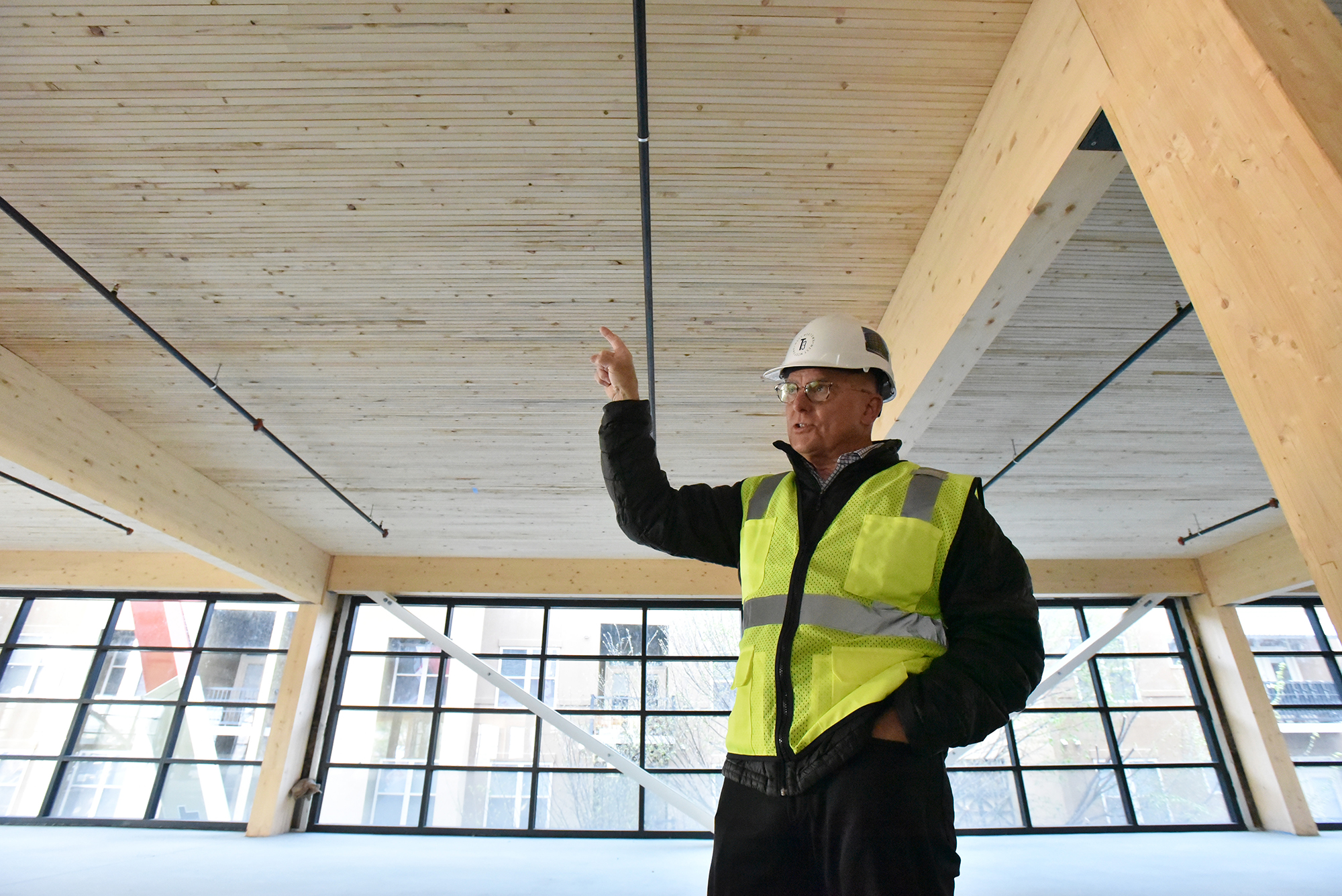 John Heagy, senior managing director for Hines Southeast Region, speaks at the construction site of T3 West Midtown at Atlantic Station. The lumber is sourced from managed forests in the Pacific Northwest and Austria, Heagy said.
