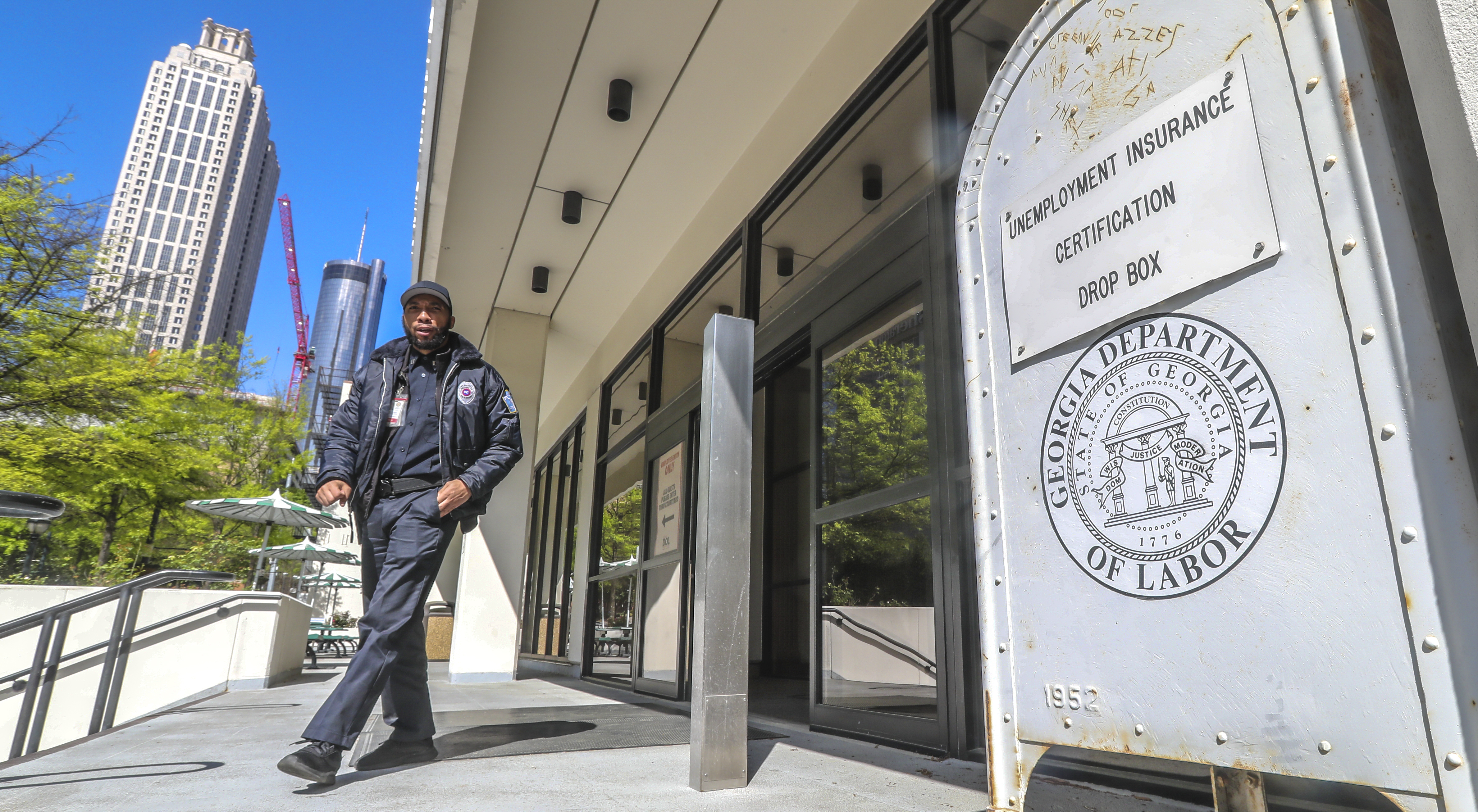 April 2, 2020 Atlanta: A security guard at the Georgia Department of Labor at 223 Courtland St NE in Atlanta walks past the unemployment certification drop box in front of the office on Thursday, April 2, 2020. Unemployment claims have skyrocketed since the COVID-19 pandemic has shut down businesses across the state and country. Georgiaâs coronavirus cases surpassed 5,000 Thursday, and the number of deaths across the state continue to grow. The latest data from the Georgia Department of Public Health shows 5,348 confirmed cases, an increase of about 13% from the 4,748 cases reported Wednesday night. Nine more Georgians have died as a result of COVID-19, the disease caused by the novel coronavirus, bringing the stateâs death toll to 163. Wednesday night. Of all that have tested positive since the outbreak began, 1,056 are hospitalized Thursday, according to the health department. Amid predictions of a steep increase in cases and with plans in place to increase daily testing capacity, officials say those numbers could balloon in the coming weeks. Scientific projections suggest the state will see thousands of new cases and hundreds of additional deaths before the virus is contained. JOHN SPINK/JSPINK@AJC.COM