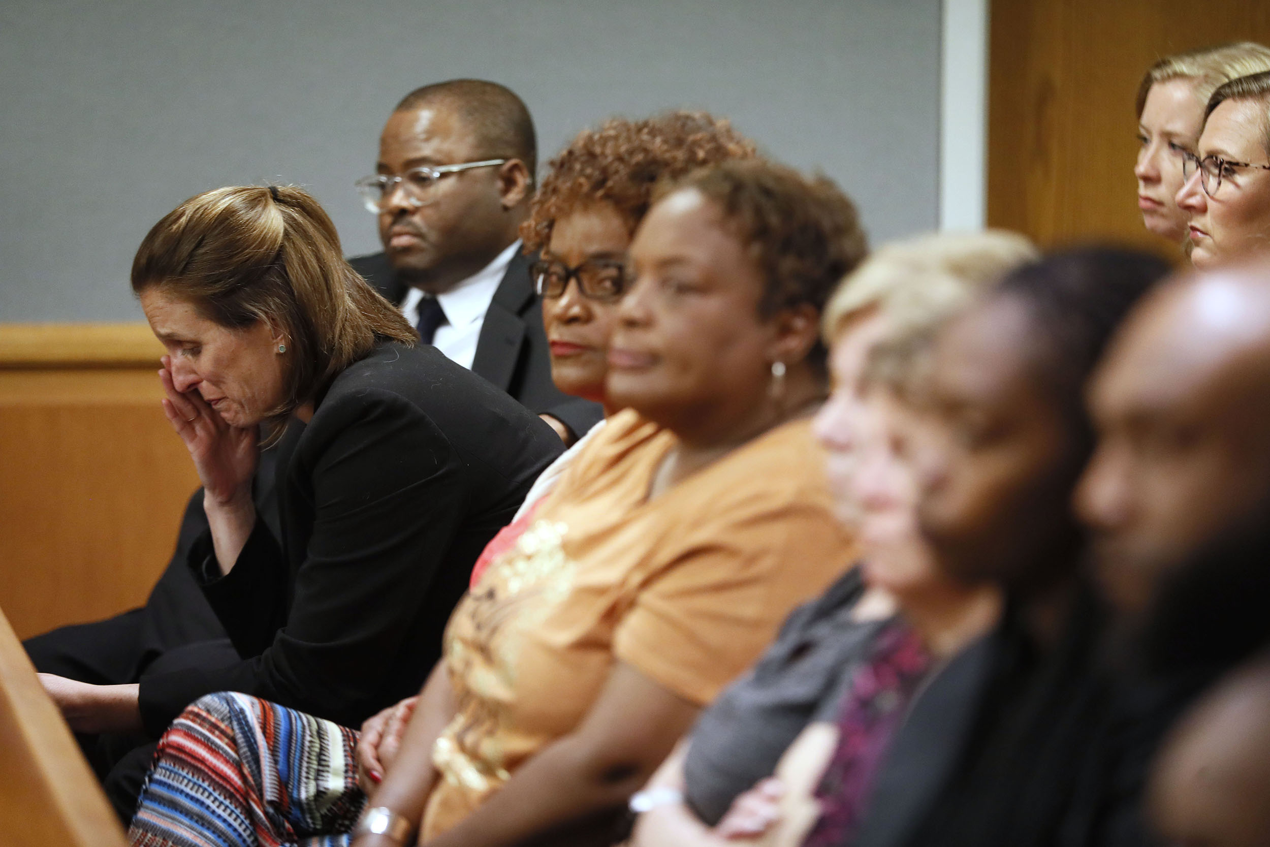 April 30, 2019 - Lawrenceville - Emily Gilbert (left) and Brad Gardner, state capital public defenders and standby council for Tiffany Moss, react to the verdict. The jury in the Tiffany Moss murder trial today sentenced her to death after they found Moss, who is representing herself, guilty of intentionally starving her 10-year-old stepdaughter Emani to death in the fall of 2013, in addition to other charges. The prosecution is asking for the death penalty. Bob Andres / bandres@ajc.com