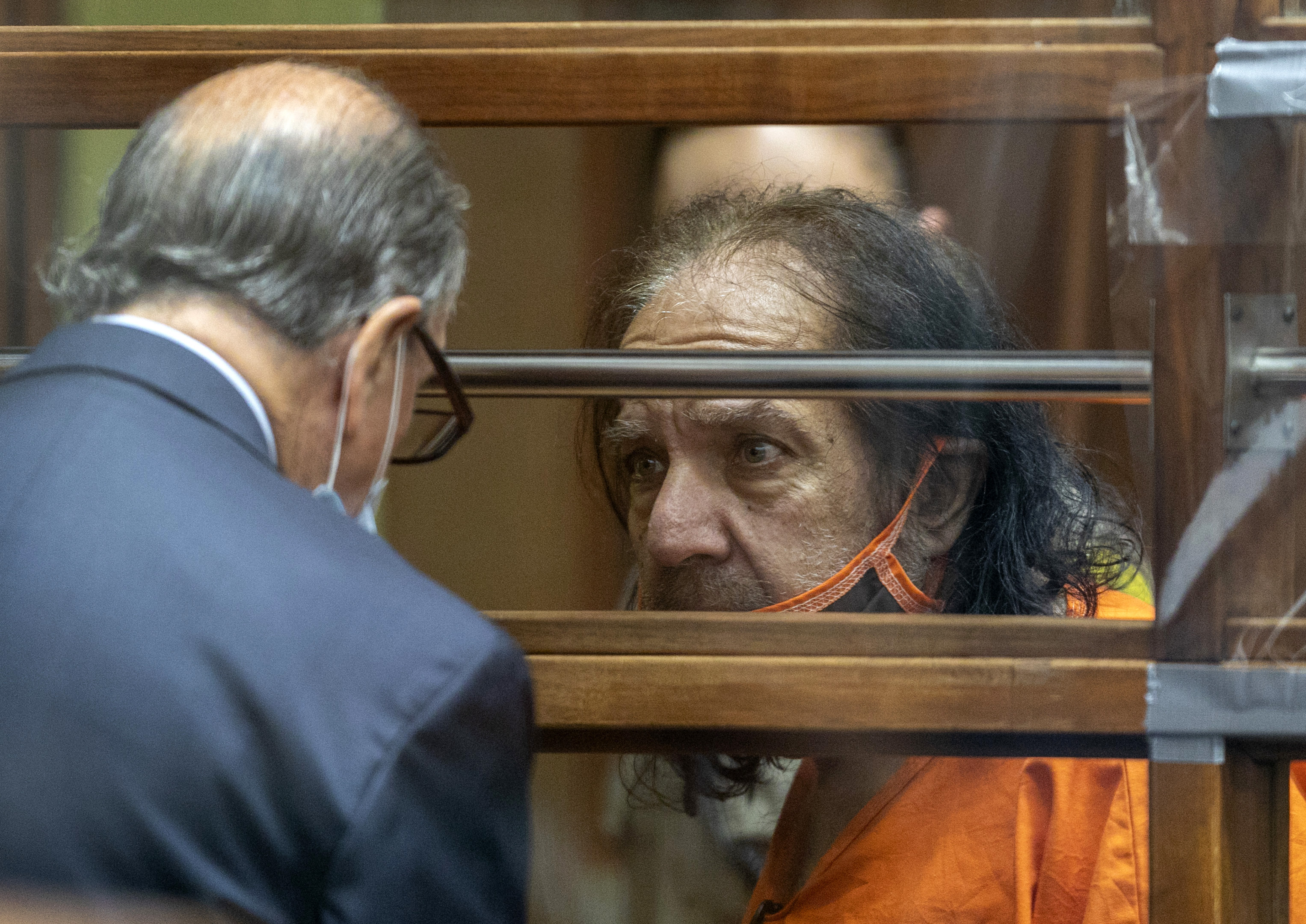 Adult film star Ron Jeremy talks with his attorney Stuart Goldfarb during his arraignment Friday. Jeremy pleaded not guilty to the charges.