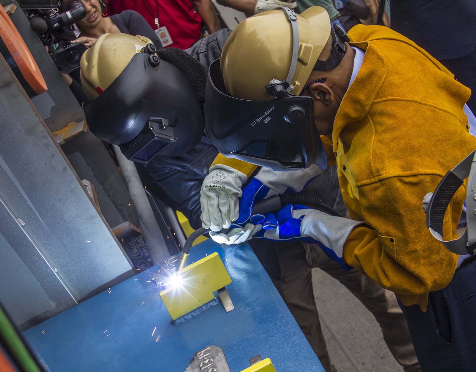 Rep. John Lewis participated in a naming ceremony at the General Dynamics NASSCO shipyard in San Diego on May 13, 2019, when he welded his initials onto the 742-foot-long refueling vessel dedicated to him. (Photo courtesy of General Dynamics NASSCO)