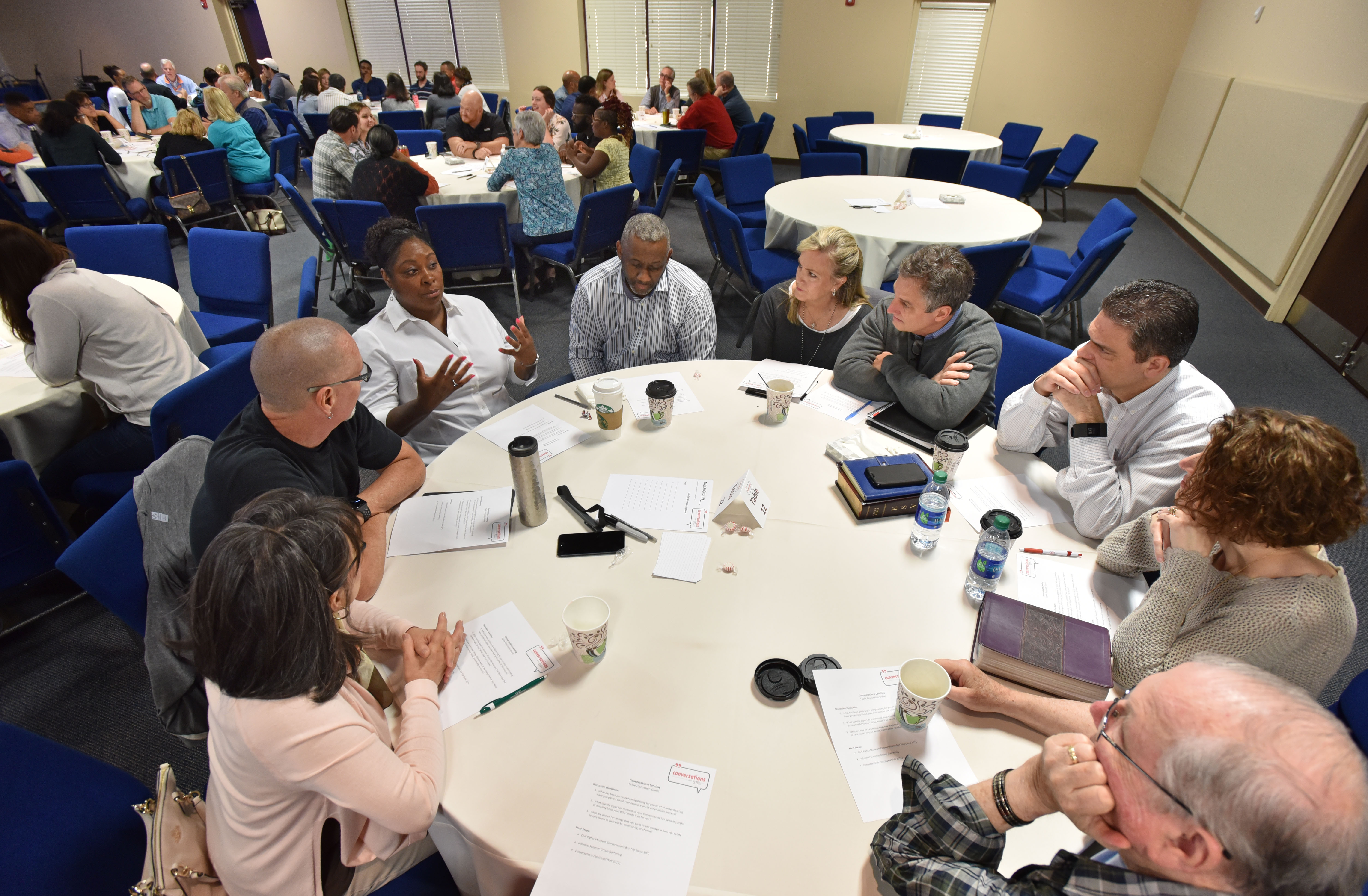 Clockwise from left, Mary Louise and Stephen Gilkenson, Corliss and Melvin Kinard, Denise and Mike Moss, Eric and Becca Anderson, and Myles Lorenzen discuss during a "Grace and Race" seminar at Eagles Nest Church in Roswell on Saturday, May 6, 2017. HYOSUB SHIN / HSHIN@AJC.COM