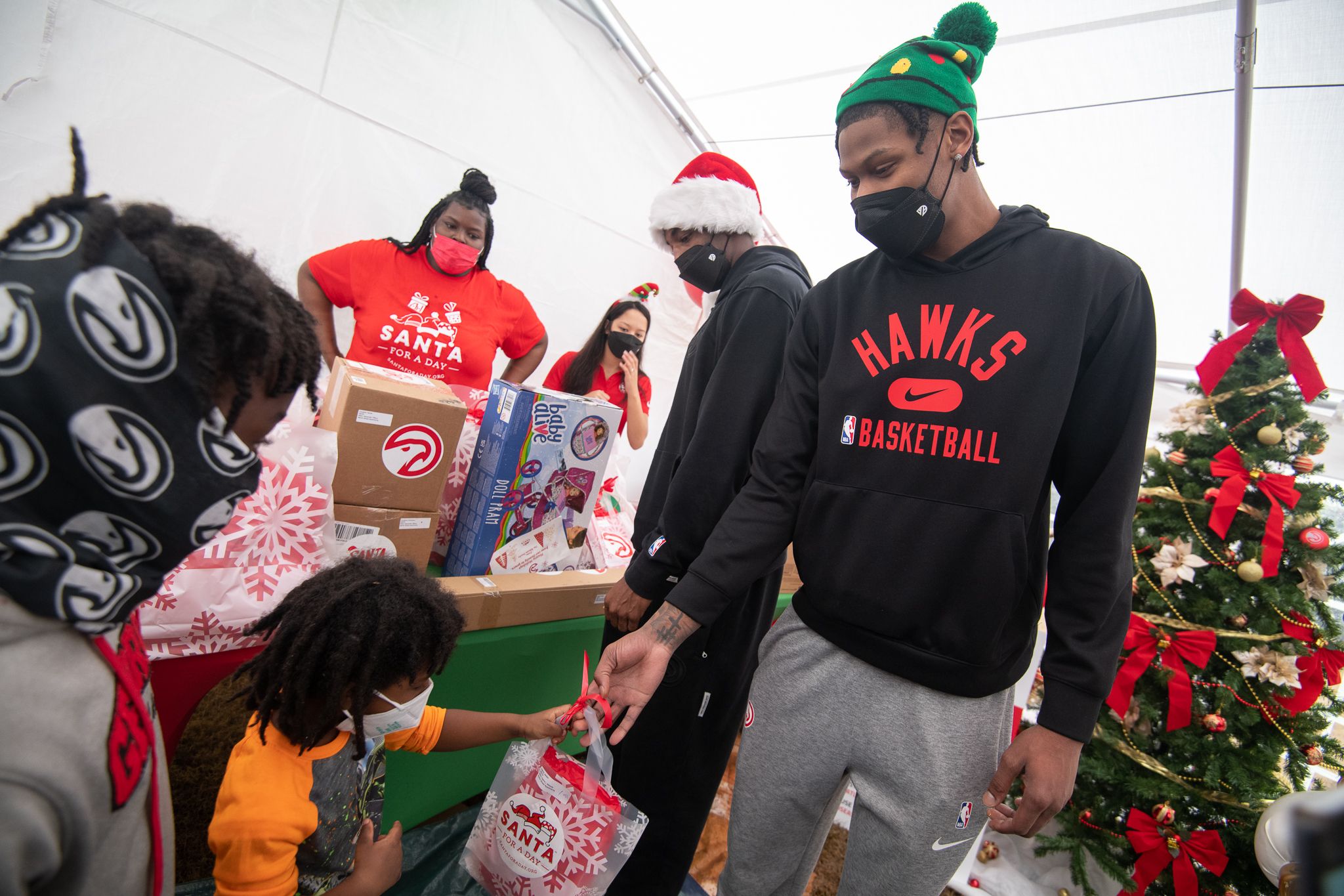 Cam Reddish made a surprise appearance at the party to hand out gifts.