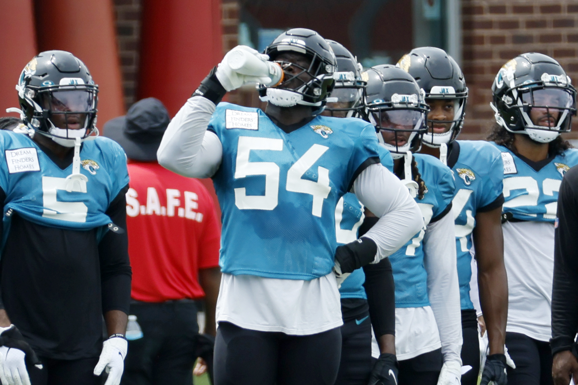 Atlanta Falcons linebacker Mykal Walker (3) and cornerback A.J. Terrell  (24) talk during a break in NFL football training camp at the team's  practice facility in Flowery Branch, Ga., Wednesday, Aug. 10