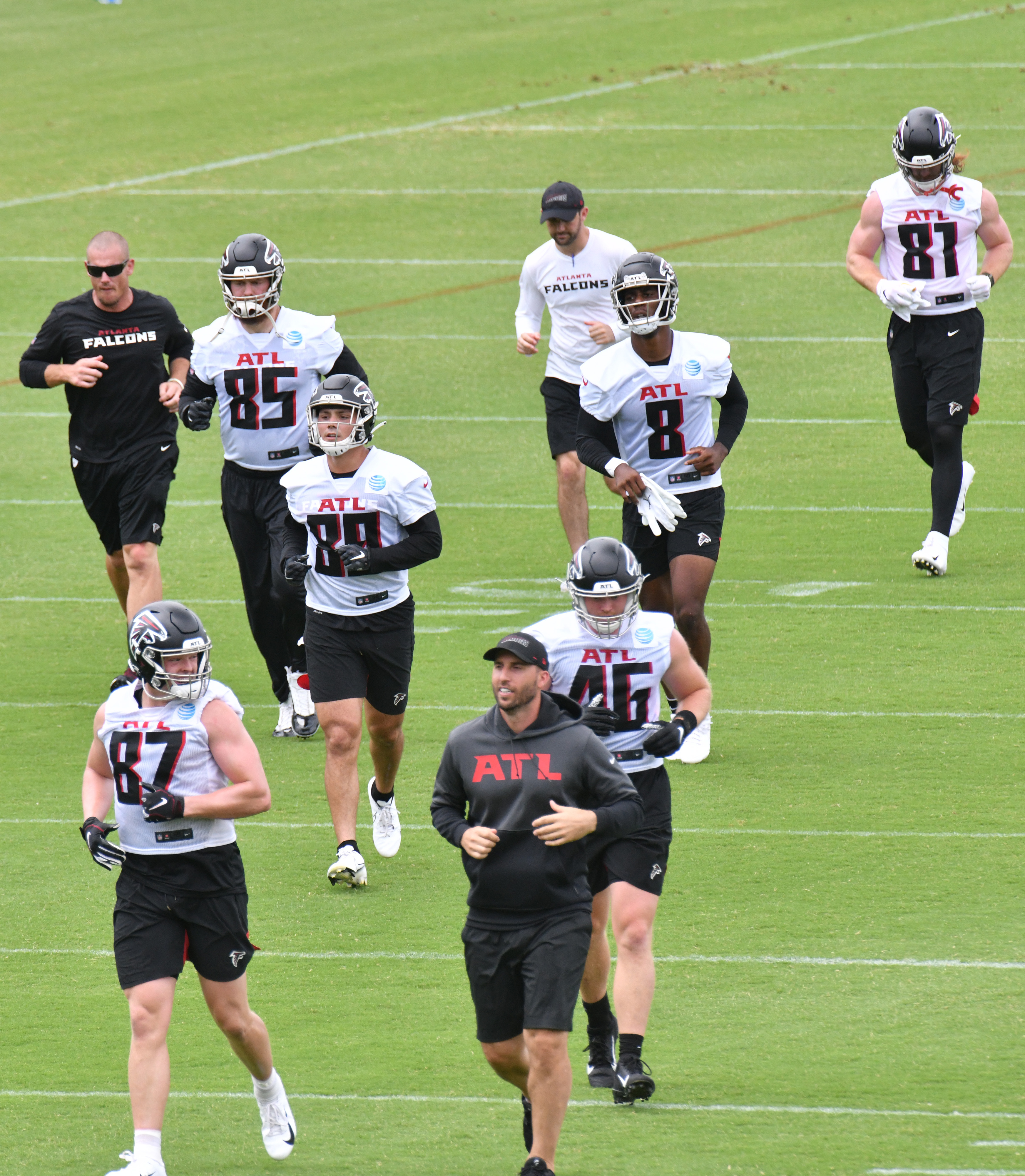 Parker Hesse and Ryan Becker of the Atlanta Falcons warm up before