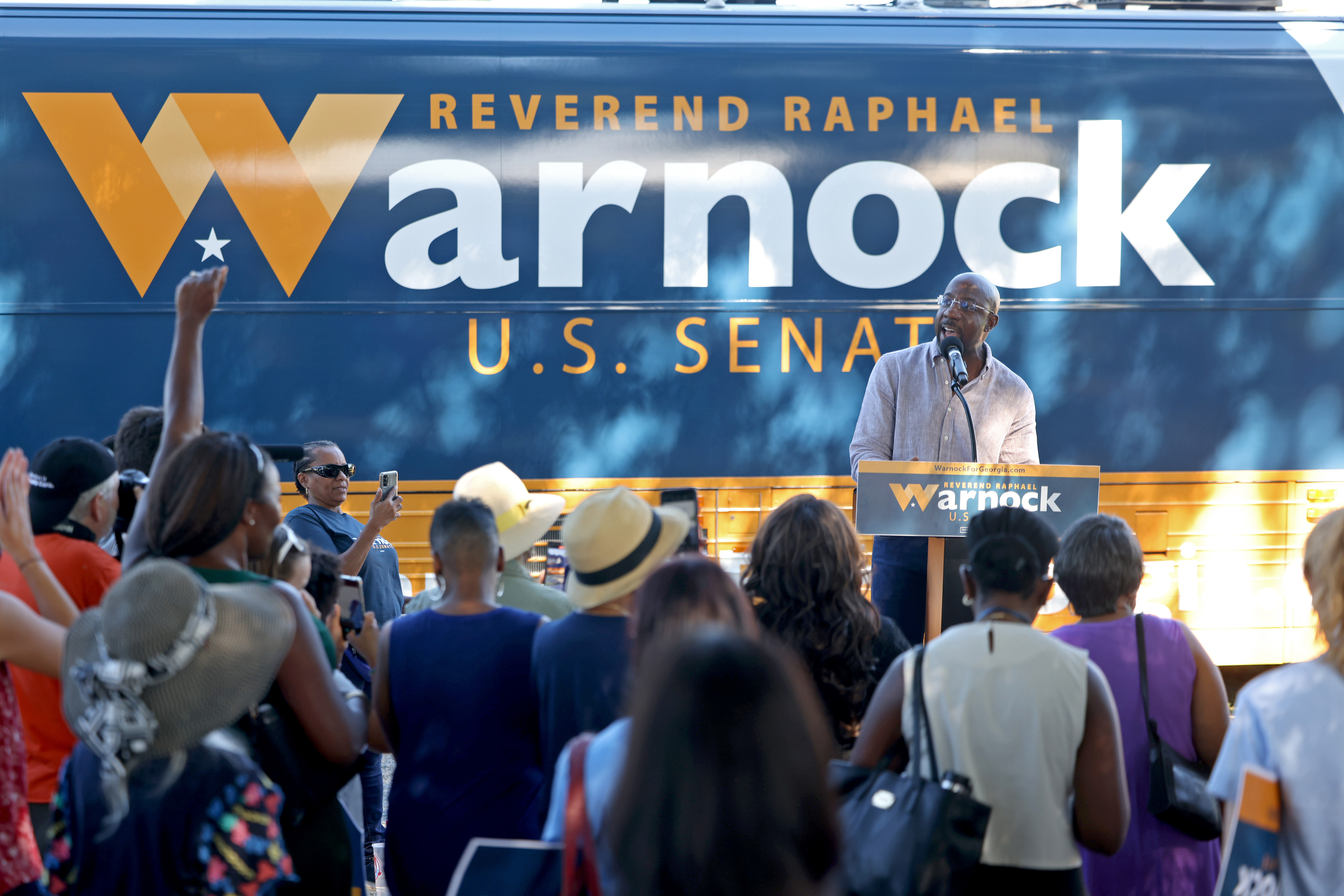 Democratic Senator Raphael Warnock greeted supporters Wednesday during his campaign at the Cobb County Civic Center. Democratic gubernatorial candidate Stacey Abrams also spoke at the rally.  (Jason Getz / Jason.Getz@ajc.com)