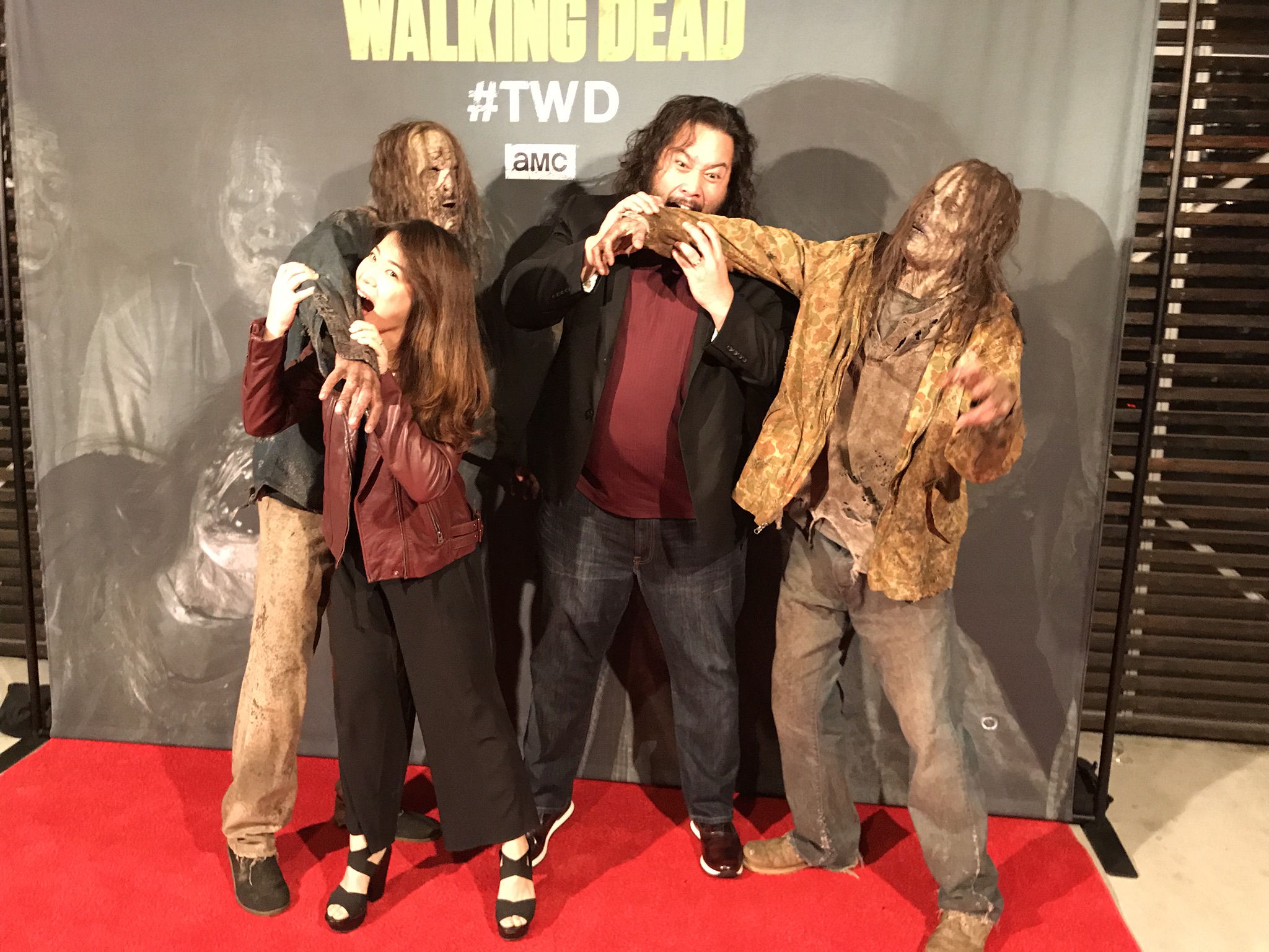 Abin Shim (L) and "Walking Dead' actor Cooper Andrews (right) turn the tables on two walkers at The Walking Dead Super Bowl party at Dallas Austin's home January 31, 2019. CREDIT: Rodney Ho/rho@ajc.com