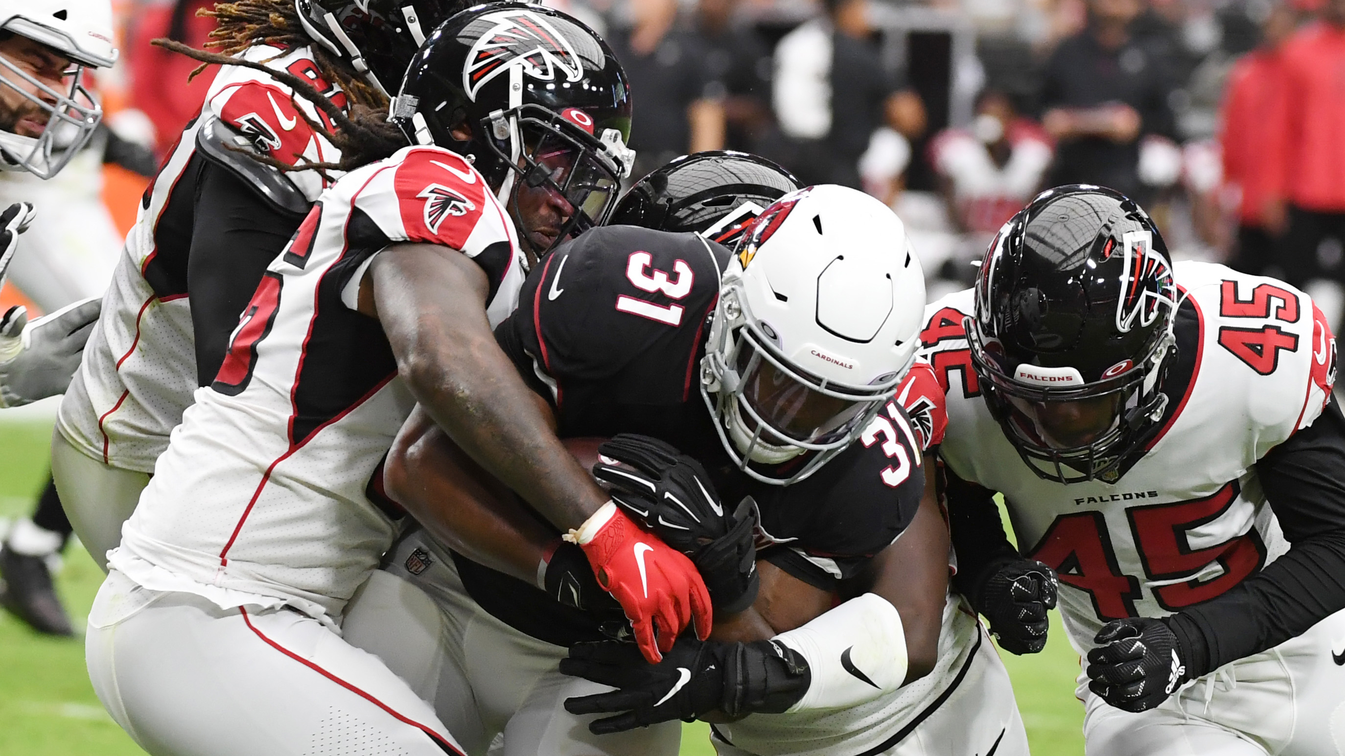 Cardinals beat Falcons 34-33 after Bryant's extra point miss