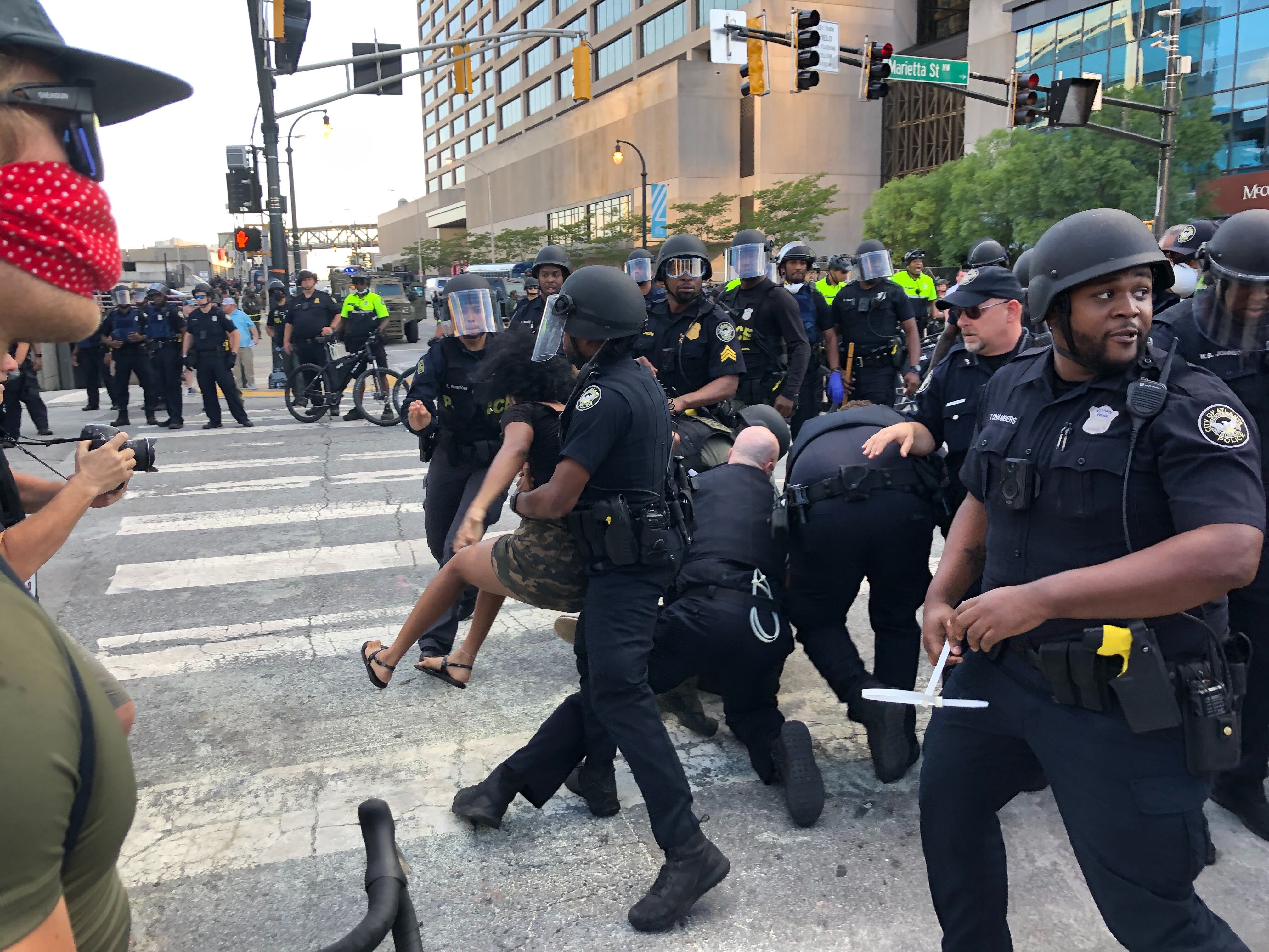 Police arrested several people who appeared to be throwing bottles of water in downtown Atlanta Saturday, May 30. 2020.