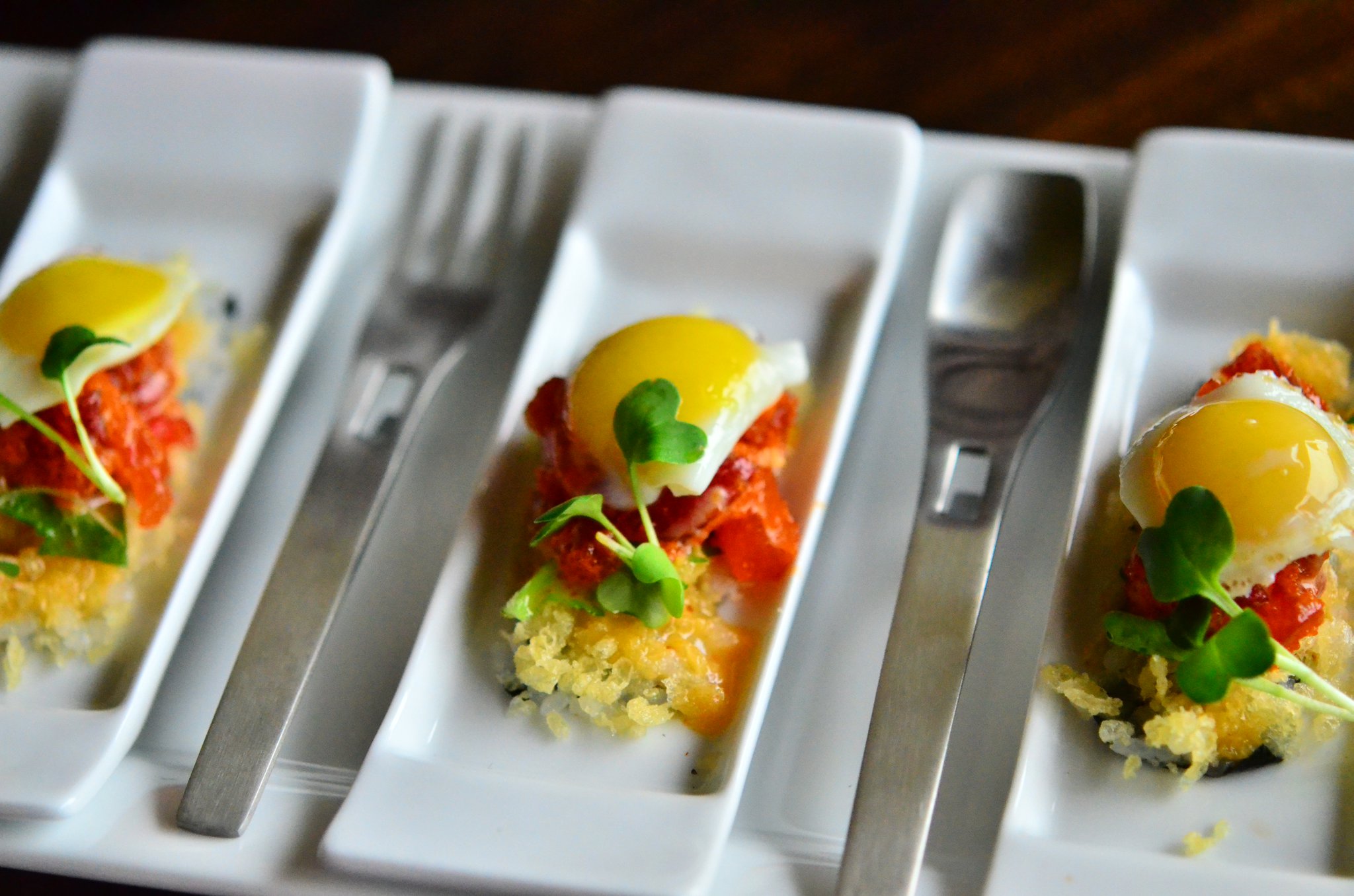 Eggs Benedict with crispy rice, spicy tuna, shiso leaf, sunny side up quail egg. (Eight Sushi Lounge)