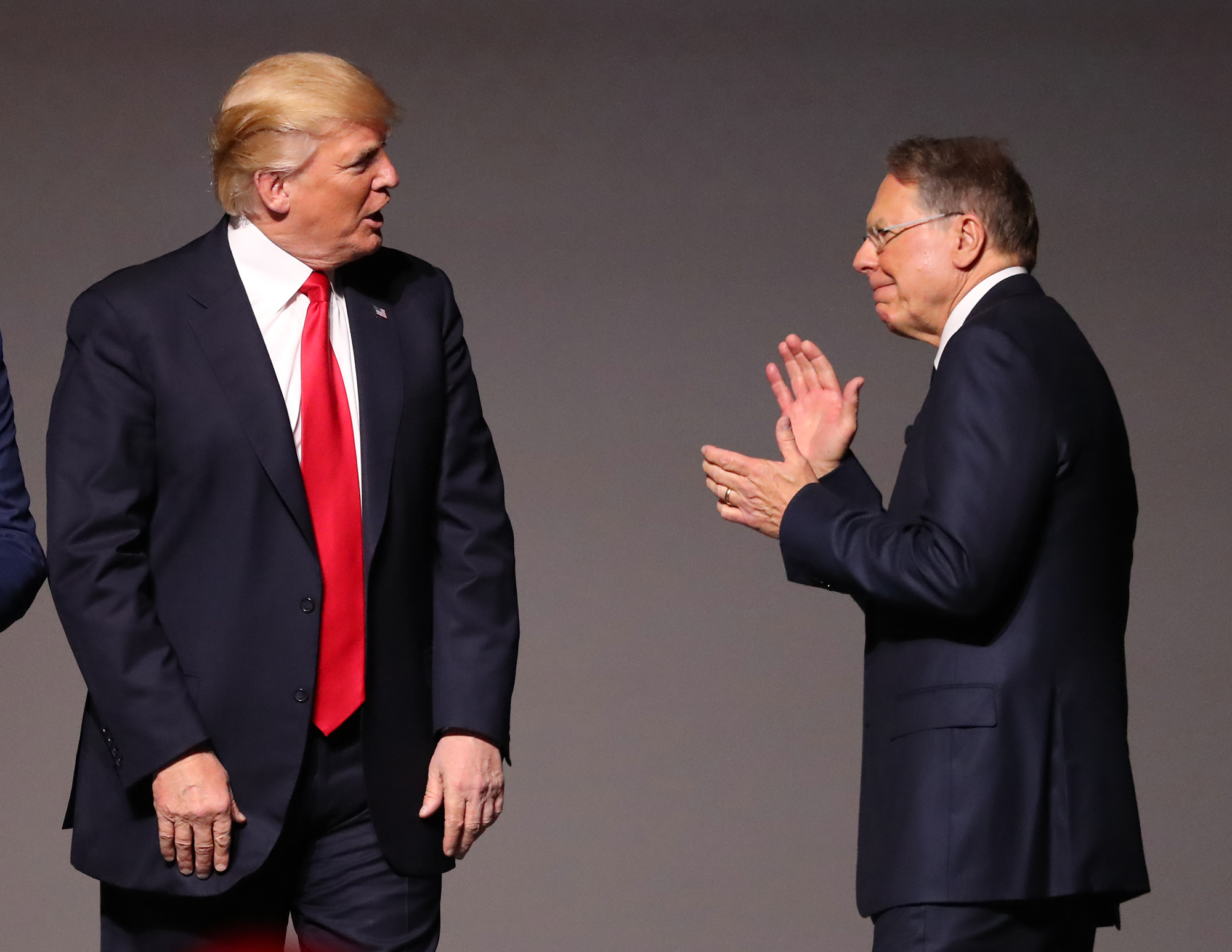 Wayne LaPierre, head of the National Rifle Association, greets President Donald Trump during the NRA's annual meeting in Atlanta last April. CURTIS COMPTON/ccompton@ajc.com