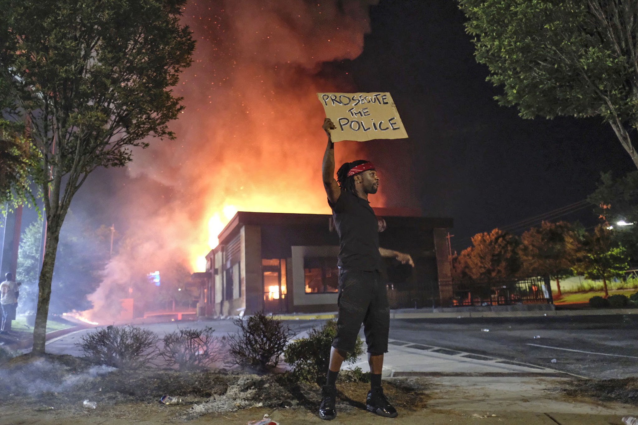 Demonstrators gathered at University Avenue on June 13, 2020, at the site of Brooks' death and set the Wendy's on fire. Protesters also blocked the interstate in a face-off with police. (Ben Gray for the Atlanta Journal Constitution)