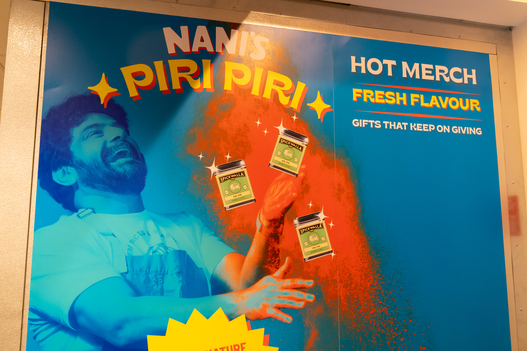 This Nani’s Piri Piri Chicken poster shows owner Meherwan Irani. (Mia Yakel for The Atlanta Journal-Constitution)