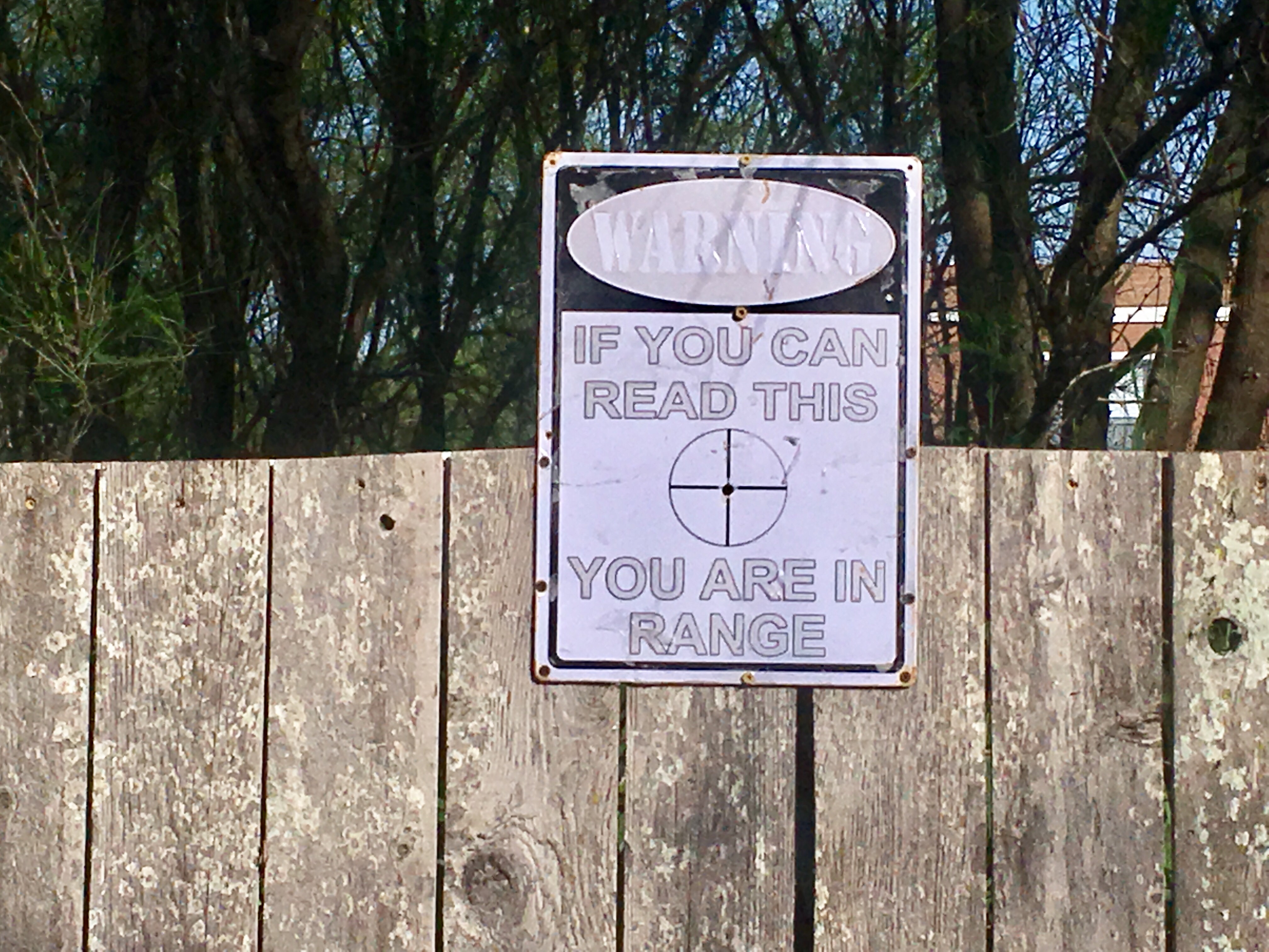 A sign posted on a fence down the road from Reality Winner's family's home. Photo: Jennifer Brett