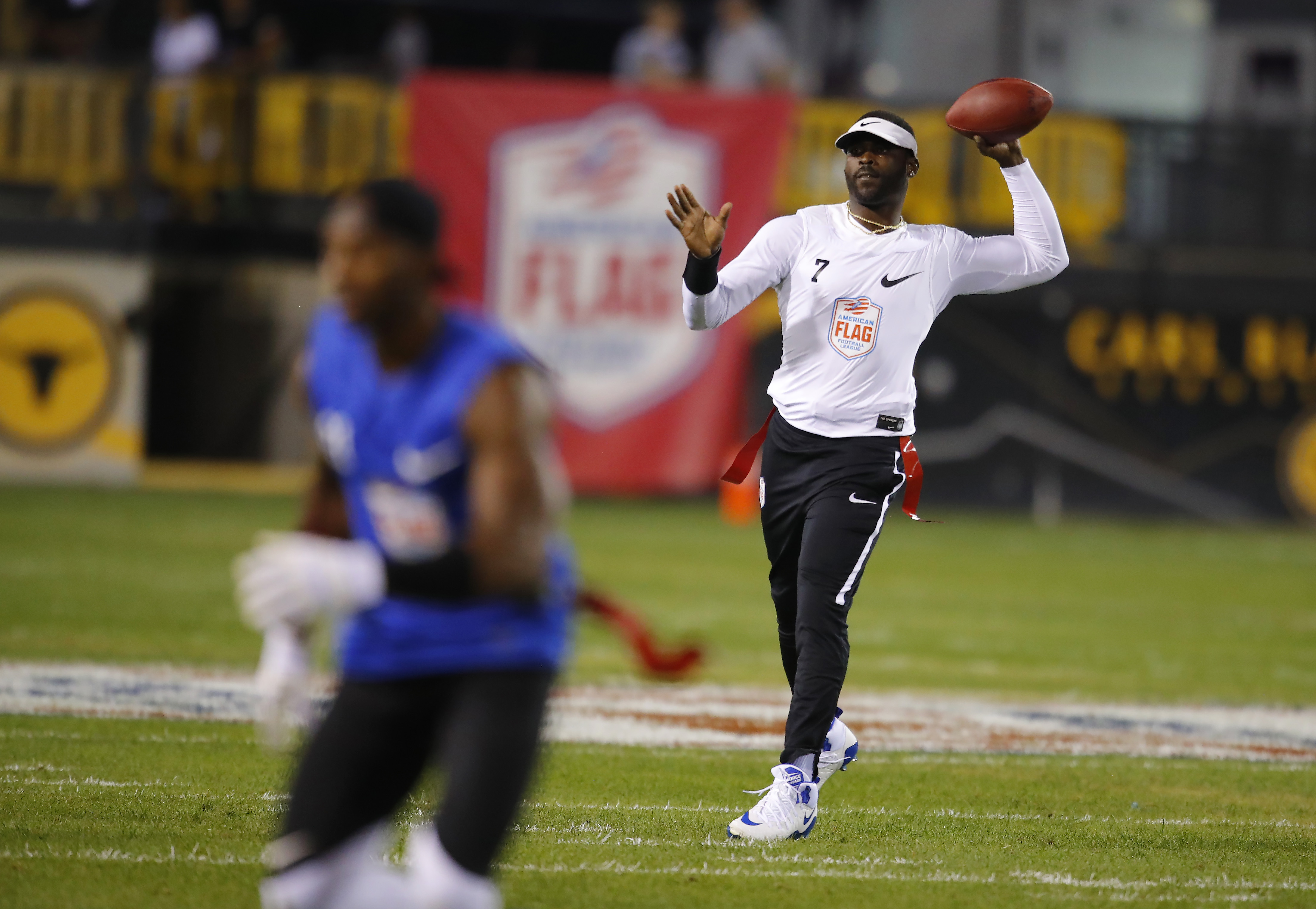 Michael Vick, other pros give flag football debut NFL feel - Sports  Illustrated