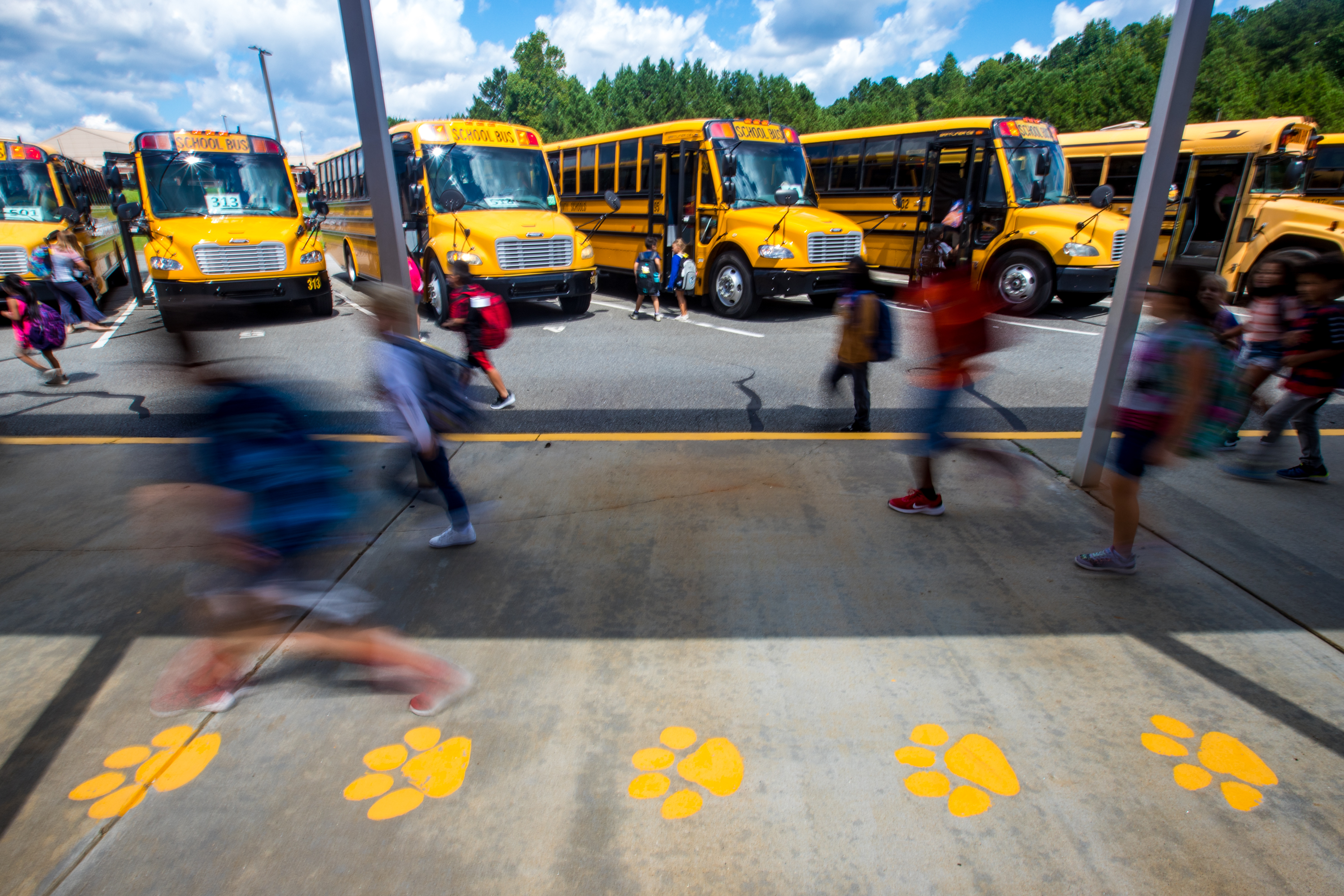 Bus riders at Liberty Elementary School in Canton finish their school day and start their ride home in Cherokee County on Thursday, Sept 2, 2021. (Jenni Girtman for The Atlanta Journal-Constitution)