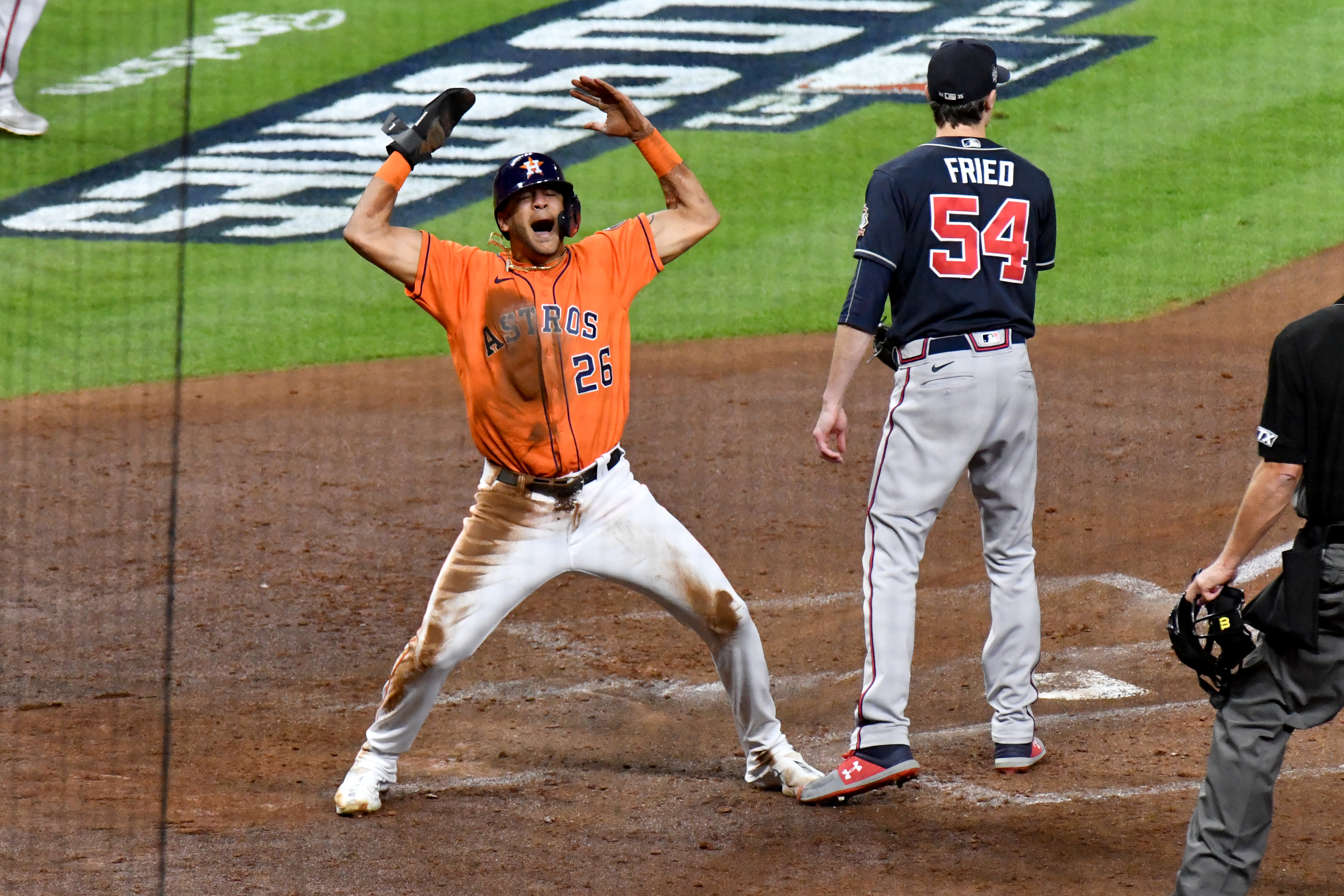 Houston Astros' Kyle Tucker is safe at second on a fielding error by  Atlanta Braves second baseman Ozzie Albies during the sixth inning in Game  2 of baseball's World Series between the