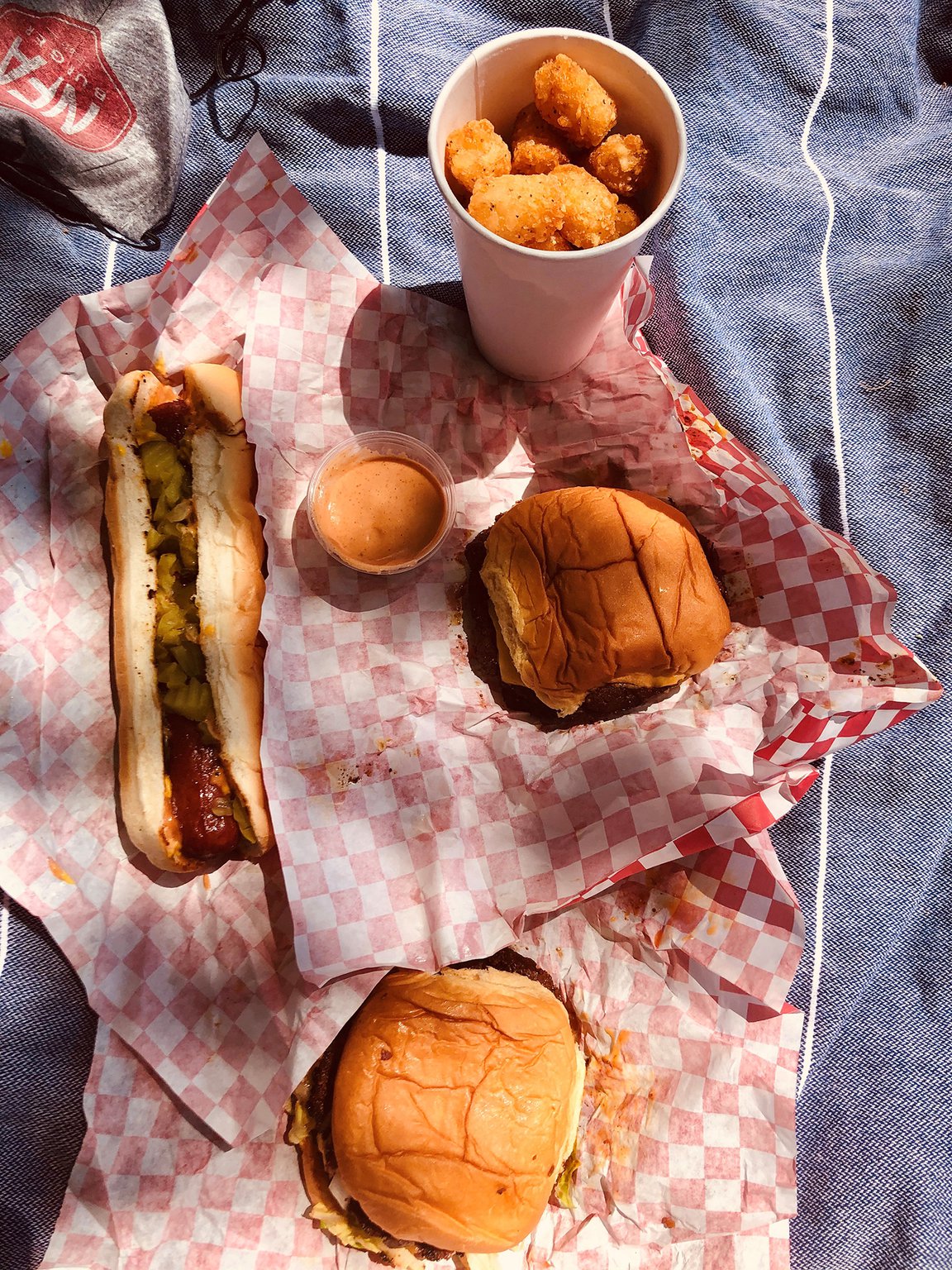 In the name of research, our writer ordered two NFA burgers, a Jersey Dog and tots. CONTRIBUTED BY WENDELL BROCK