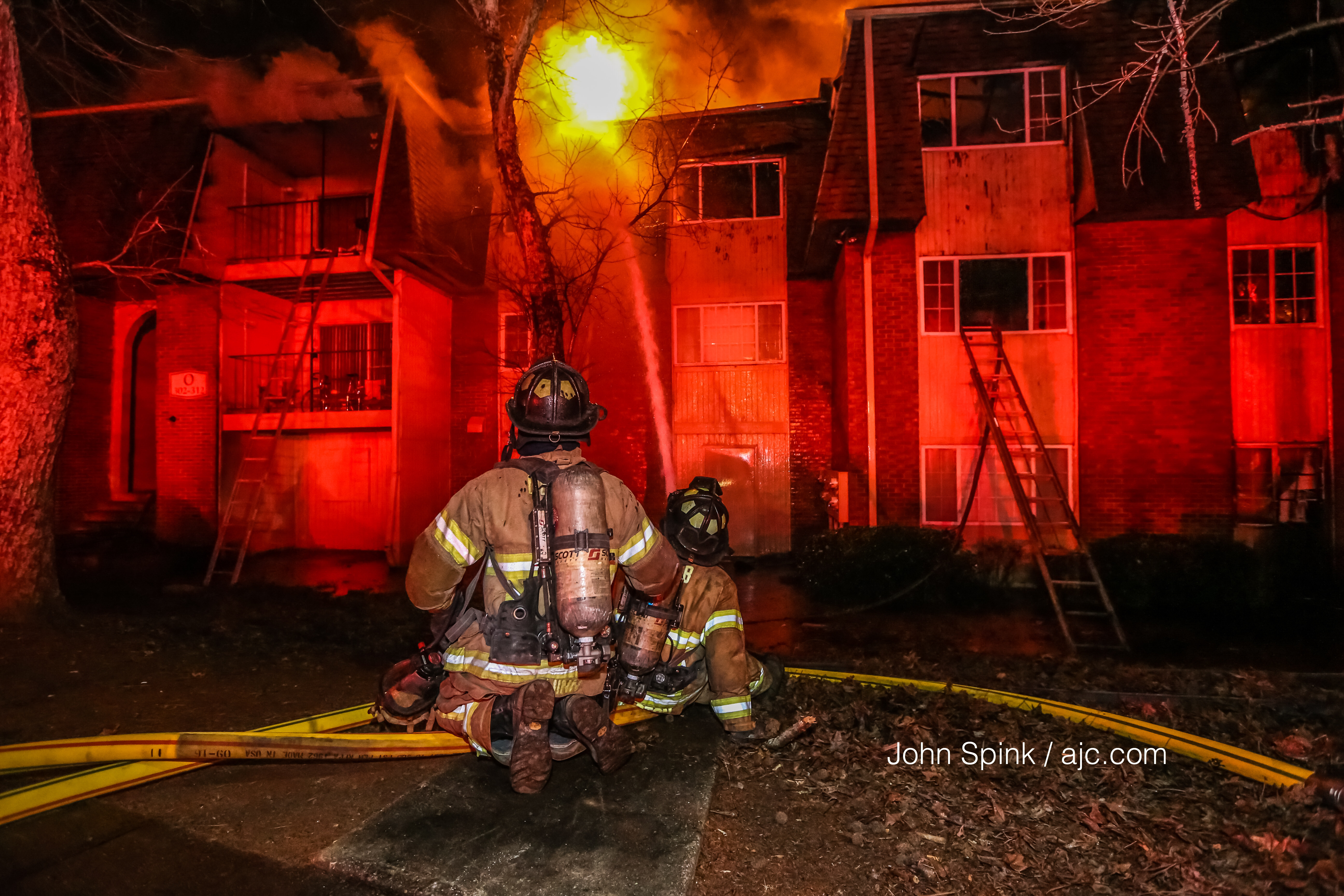 About 45 firefighters responded to an apartment fire on Pine Tree Circle in DeKalb County. JOHN SPINK / JSPINK@AJC.COM