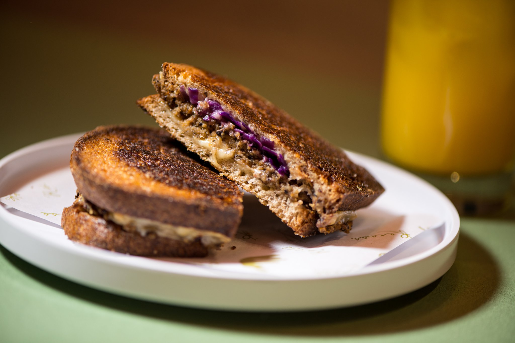 Mushroom Patty Melt with shiitake and cremini patty, Swiss cheese, red cabbagre, mustard aioli, and rye bread. Photo credit- Mia yakel.