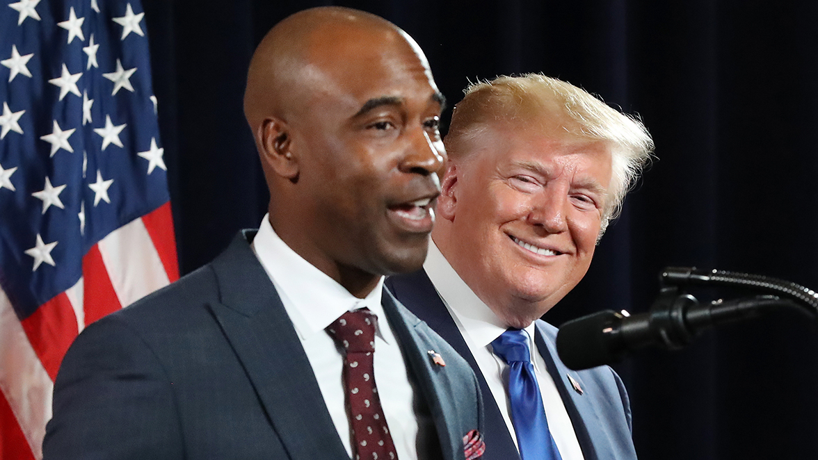 Republican Kelvin King (left) to challenge Warnock in the 2022 Senate contest. Then, President Donald Trump looks on, while King joins him on stage to speak during the Black Voices for Trump Coalition Rollout on Friday, November 8, 2019, in Atlanta. (Curtis Compton/Atlanta Journal-Constitution/TNS)