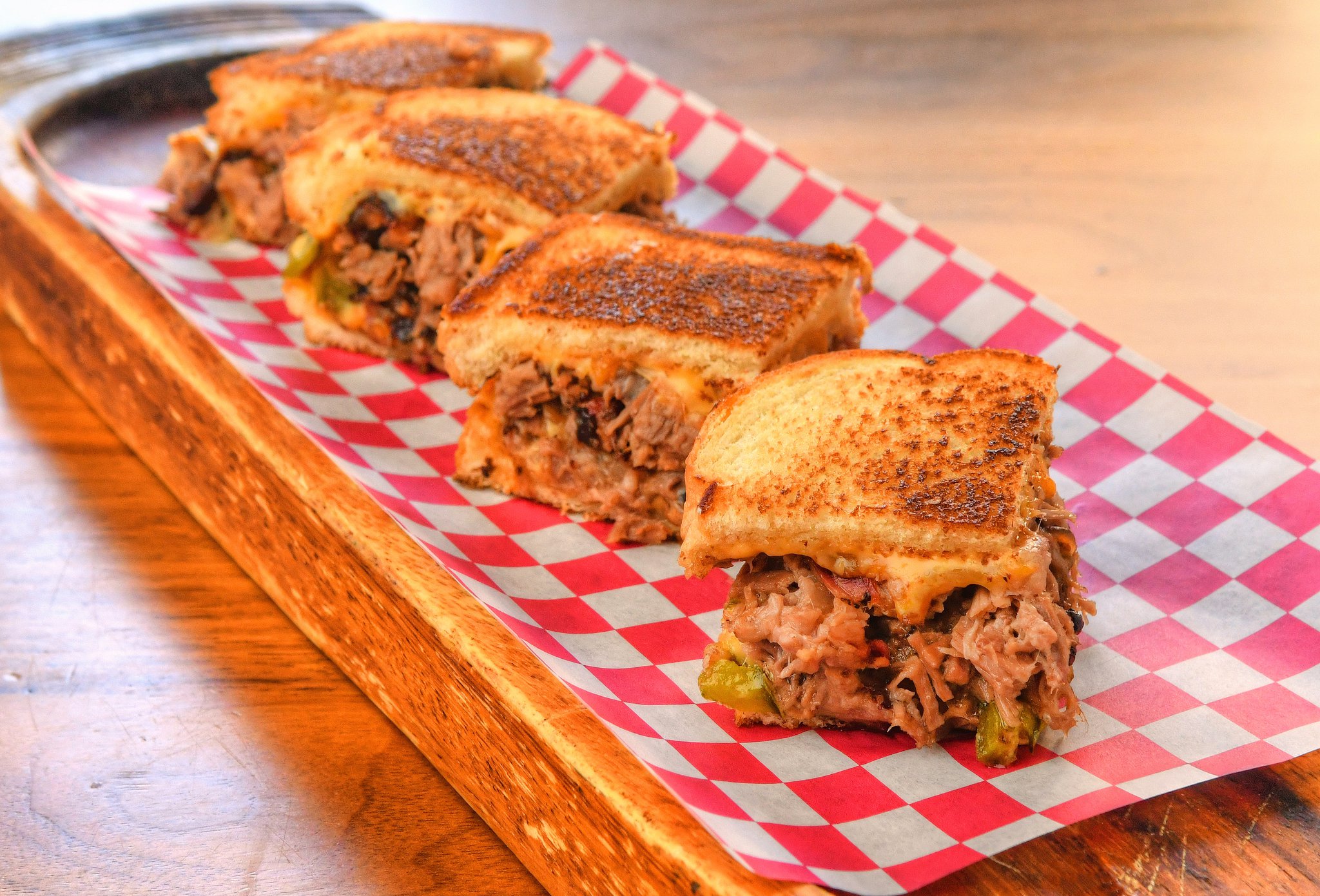 Dixie Q’s Brisket Grilled Cheese with Caramelized Onions and Poblano Peppers was developed by Scott Serpas, pitmaster and owner of Brookhaven’s Dixie Q. It was the Judge’s Choice Winner at the 2019 Atlanta Grilled Cheese Festival. CONTRIBUTED BY CHRIS HUNT PHOTOGRAPHY