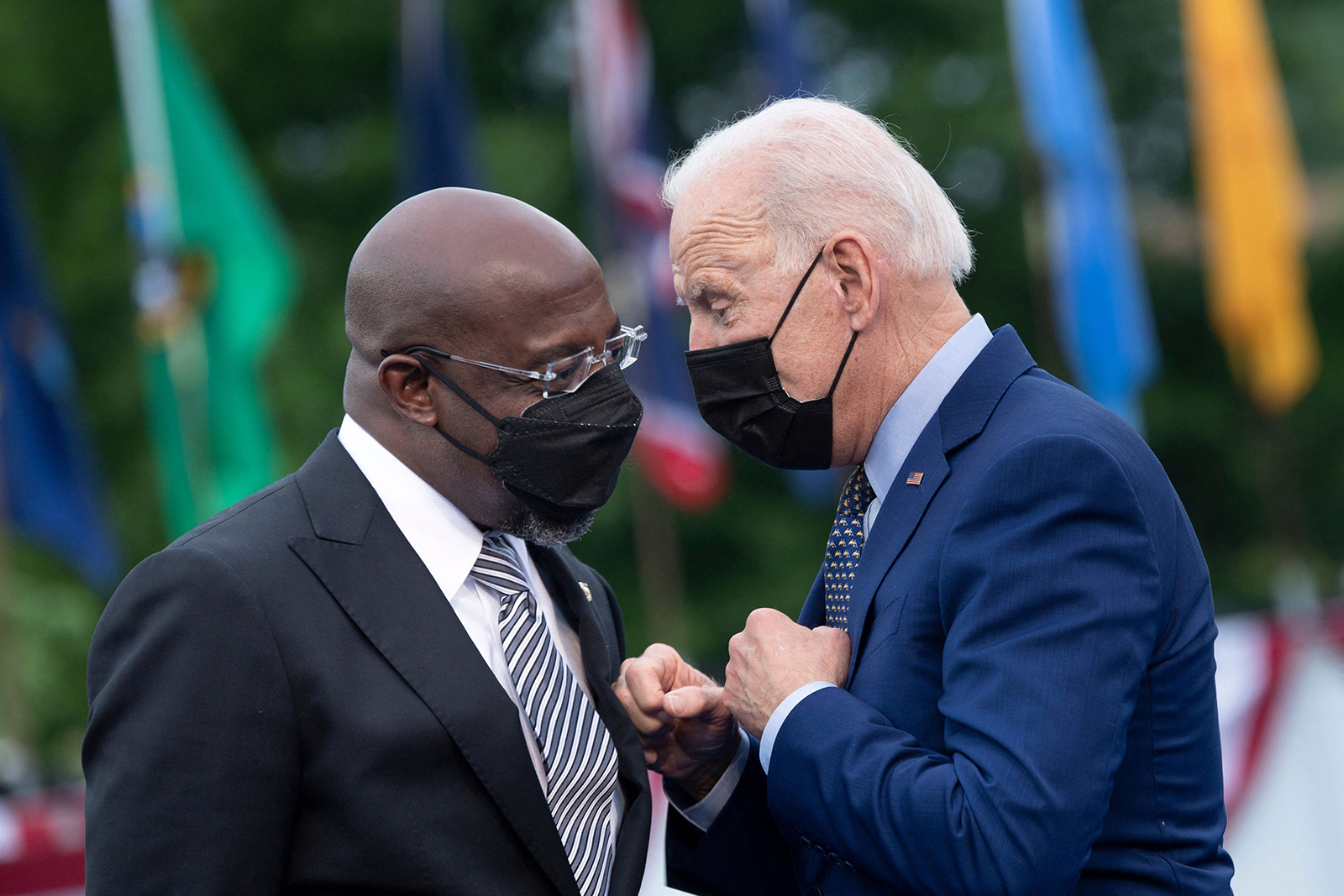 U.S. Sen. Raphael Warnock, left, is in a close race with Republican Herschel Walker in the newest Atlanta Journal-Constitution poll. Meanwhile, President Joe Biden is underwater, with 60% saying they somewhat or strongly disapprove of his job performance. (Brendan Smialowski/AFP via Getty Images/TNS)