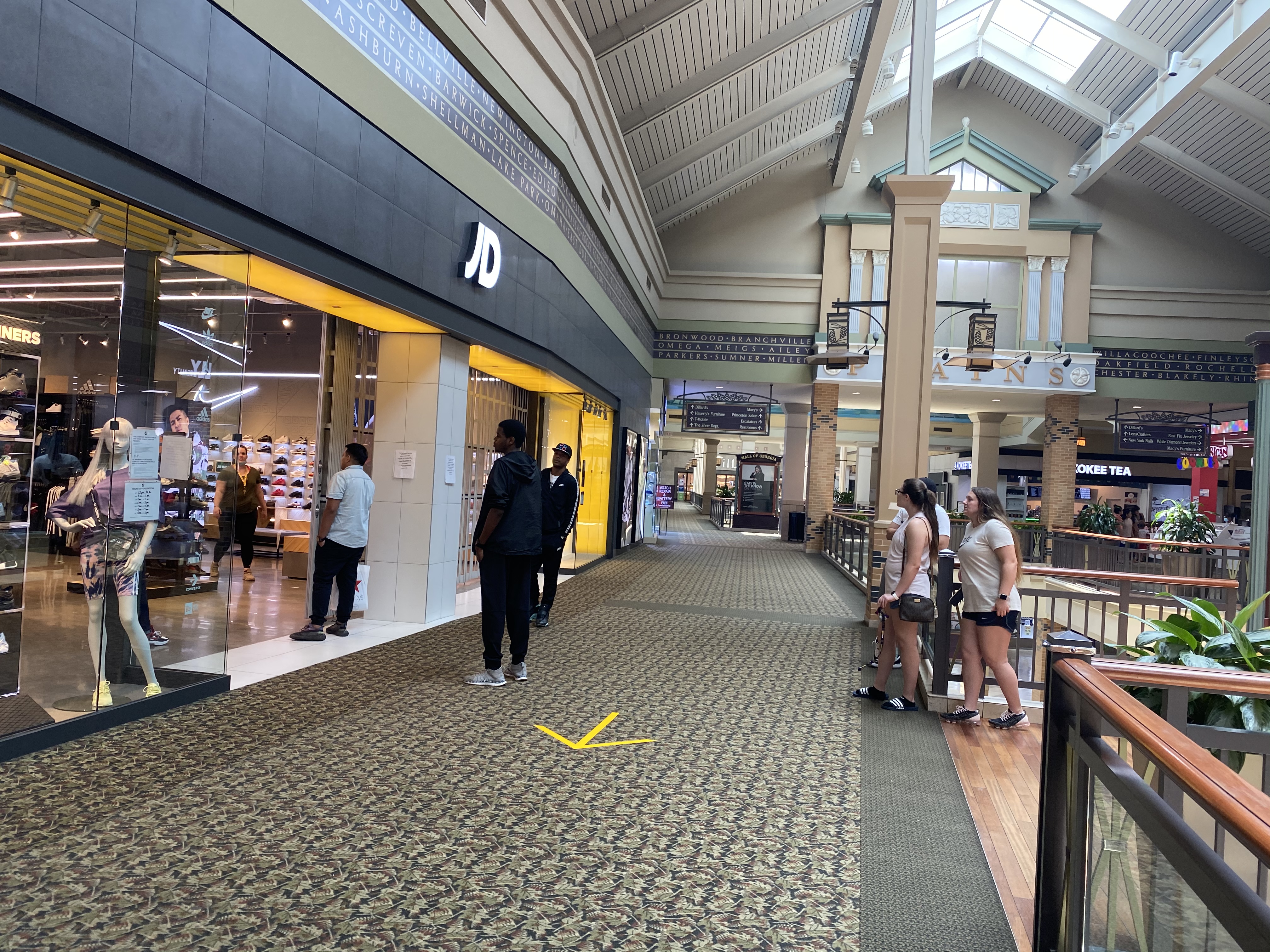Atlanta, GA, USA. 8th May, 2020. Shoppers slowly began showing up at Atlanta  area malls as COVID-19 restrictions were lifted in Georgia.Pictured: A  handful of shoppers stroll through Lenox Mall, one of