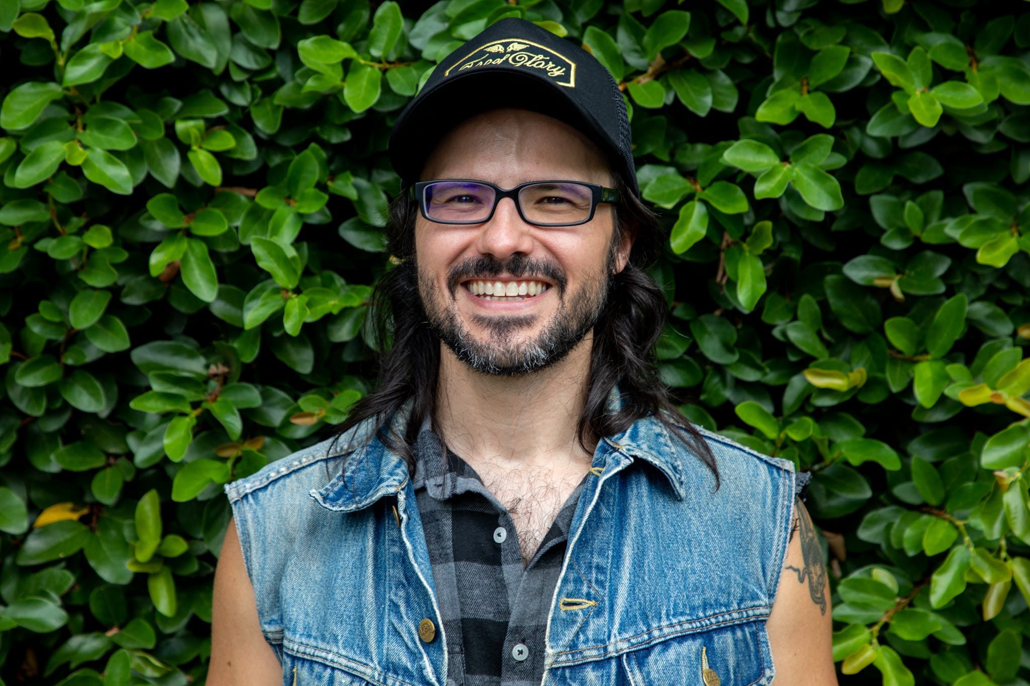 Savannah author Taylor Brown smiles for a photo on July 28, 2021, just outside of the Foxy Loxy Cafe's back patio. Brown is the author of five novels.