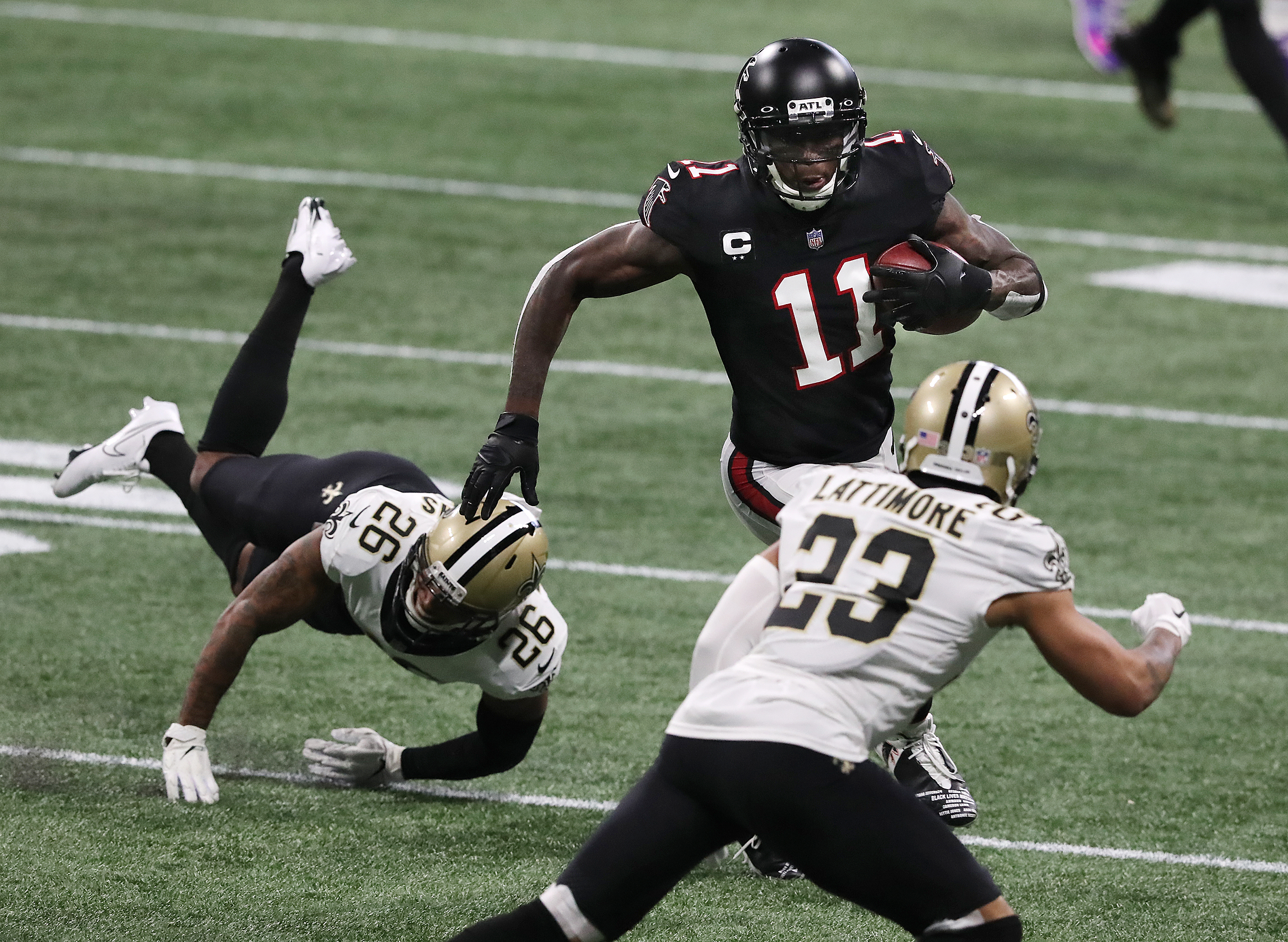 Falcons wide receiver Julio Jones makes a first-down reception against the New Orleans Saints during the first half Sunday, Dec. 6, 2020, at Mercedes-Benz Stadium in Atlanta. (Curtis Compton / Curtis.Compton@ajc.com)