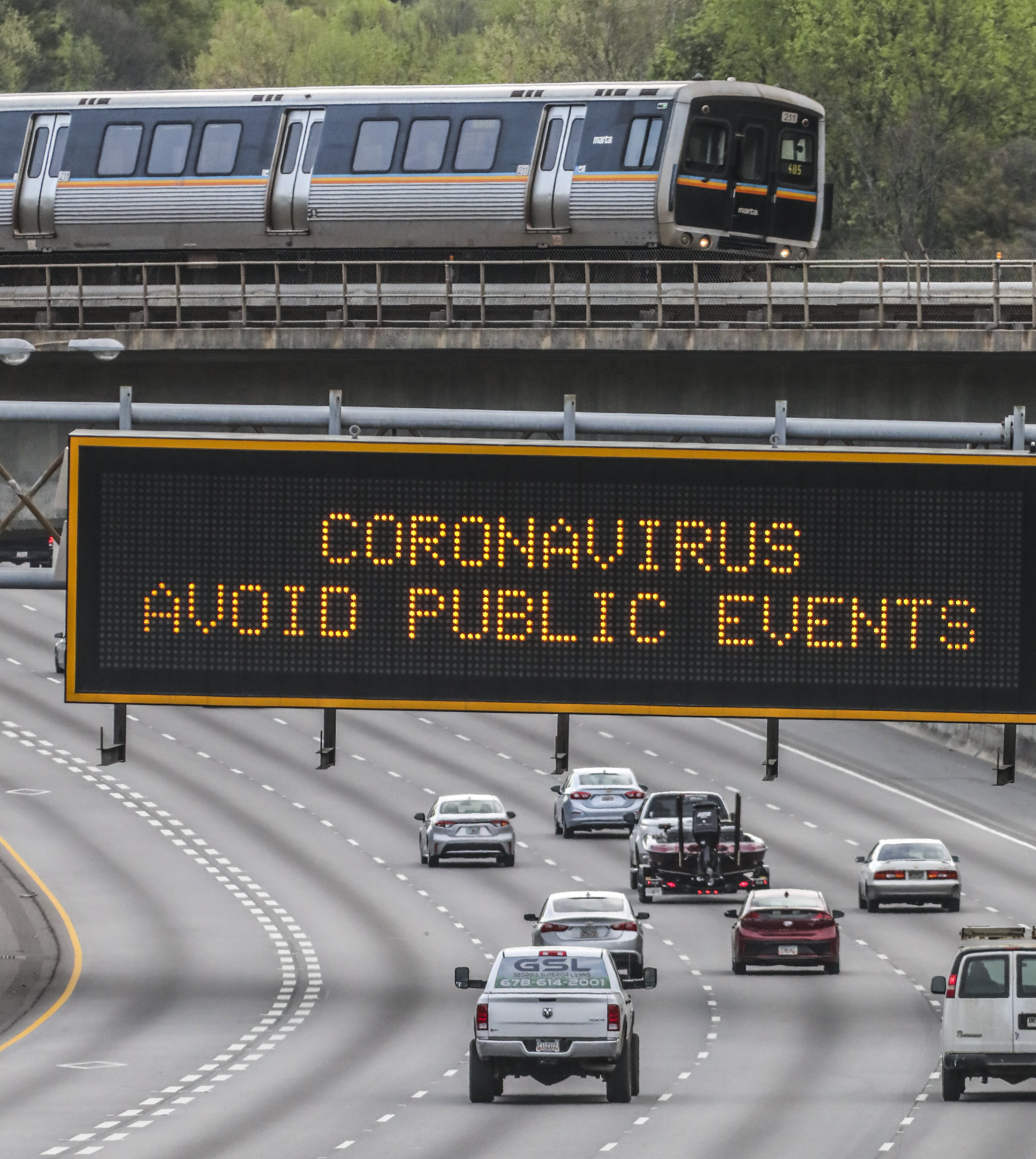 March 27, 2020 Atlanta: GDOT electronic signs across the metro were displaying COVID-19 messages for motorists Monday morning, March 30, 2020, this one on NB I-85 near the Brookwood exchange. For the third day in a row, the number of new coronavirus cases has slowed significantly in Georgia, even as deaths continue to climb. There are now at least 2,809 confirmed cases of the virus statewide, according to the latest data released Monday by the Georgia Department of Public Health. The latest figures are an increase of less than 5% from Sundayâs cases, much less than the average daily growth the state saw last week. Eighty-seven Georgians have died from COVID-19, the disease caused by the novel virus, up from 83 reported on Sunday. Less than one-third of those infected are hospitalized. JOHN SPINK/JSPINK@AJC.COM