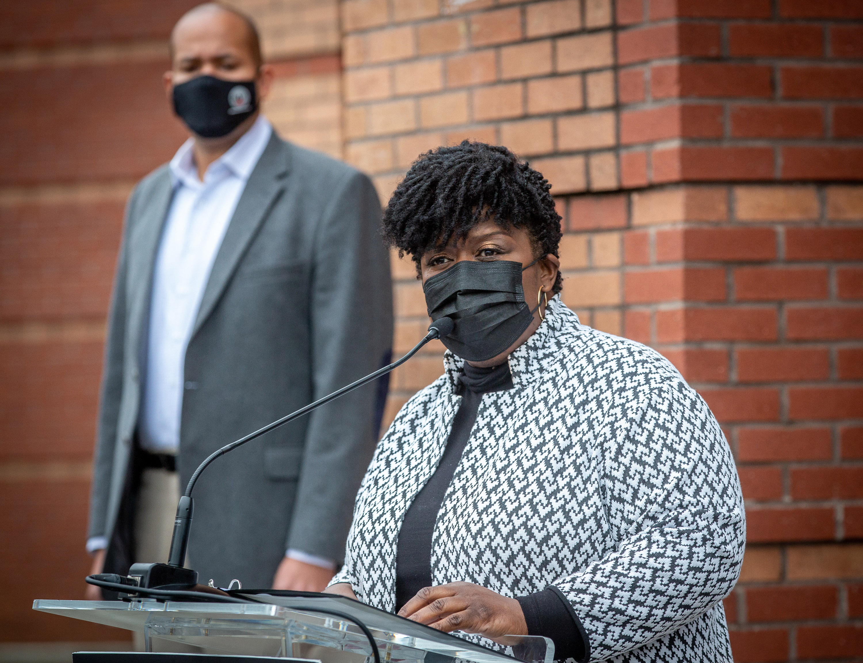 Atlanta Public Schools Superintendent Lisa Herring talks at a news conference at M. Agnes Jones Elementary School in Atlanta on Monday as school board Chairman Jason Esteves looks on. STEVE SCHAEFER FOR THE ATLANTA JOURNAL-CONSTITUTION