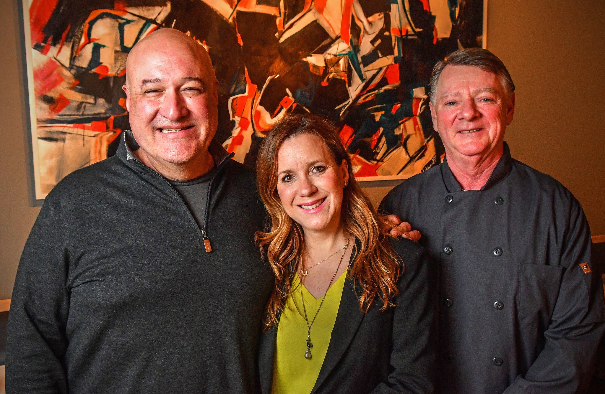 L-R: Executive chef, Jimmy Carey, Camille Olabarrieta, executive chef, Bobby Holley at Jimmy'z Kitchen in Marietta. (Contributed by Chris Hunt Photography)