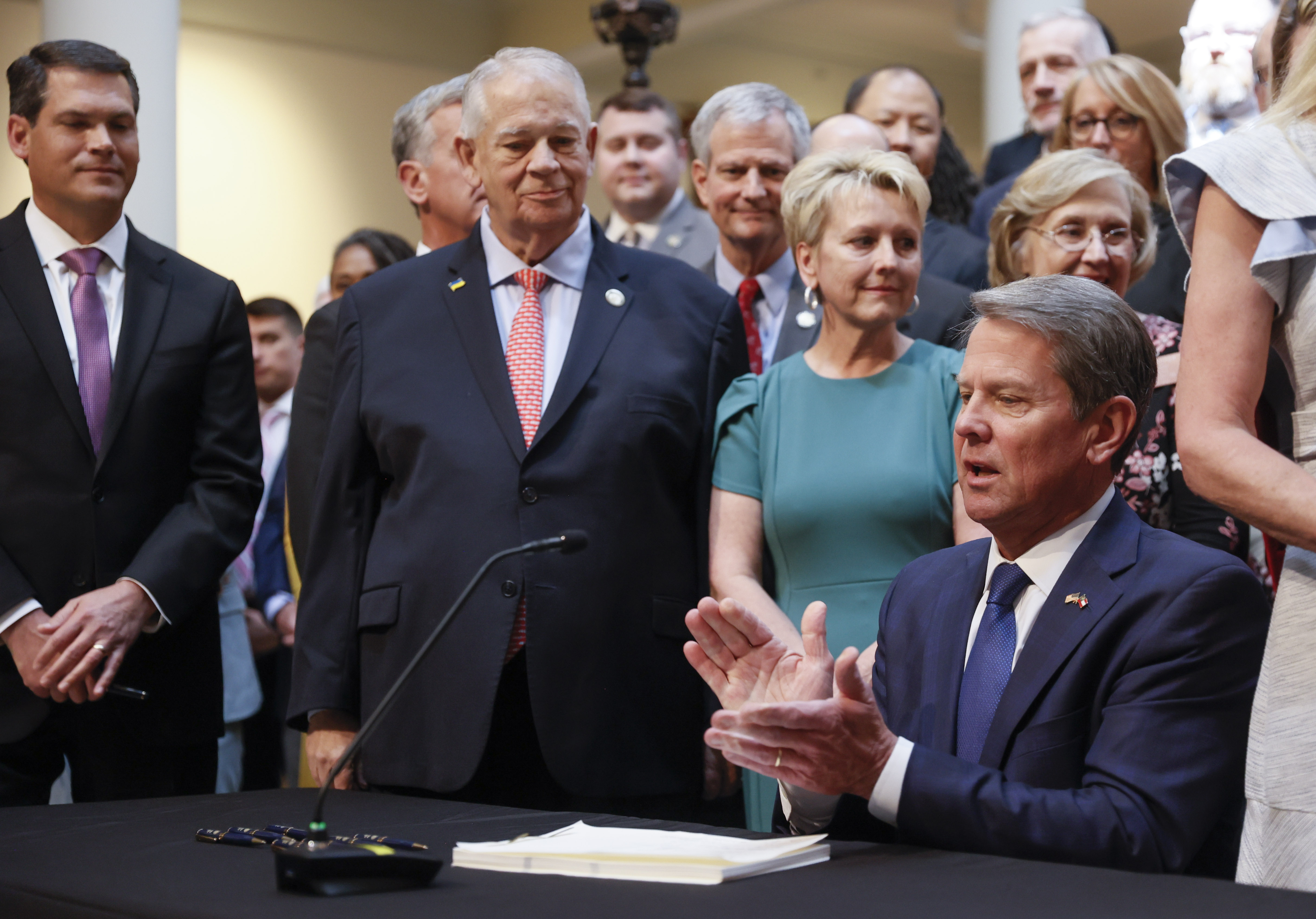 With much fanfare, Gov. Brian Kemp signs HB 1013, which aims to increase access to mental health coverage in Georgia on Sine Die, the last day of the General Assembly at the Georgia State Capitol in Atlanta on Monday, April 4, 2022. (Bob Andres / robert.andres@ajc.com)