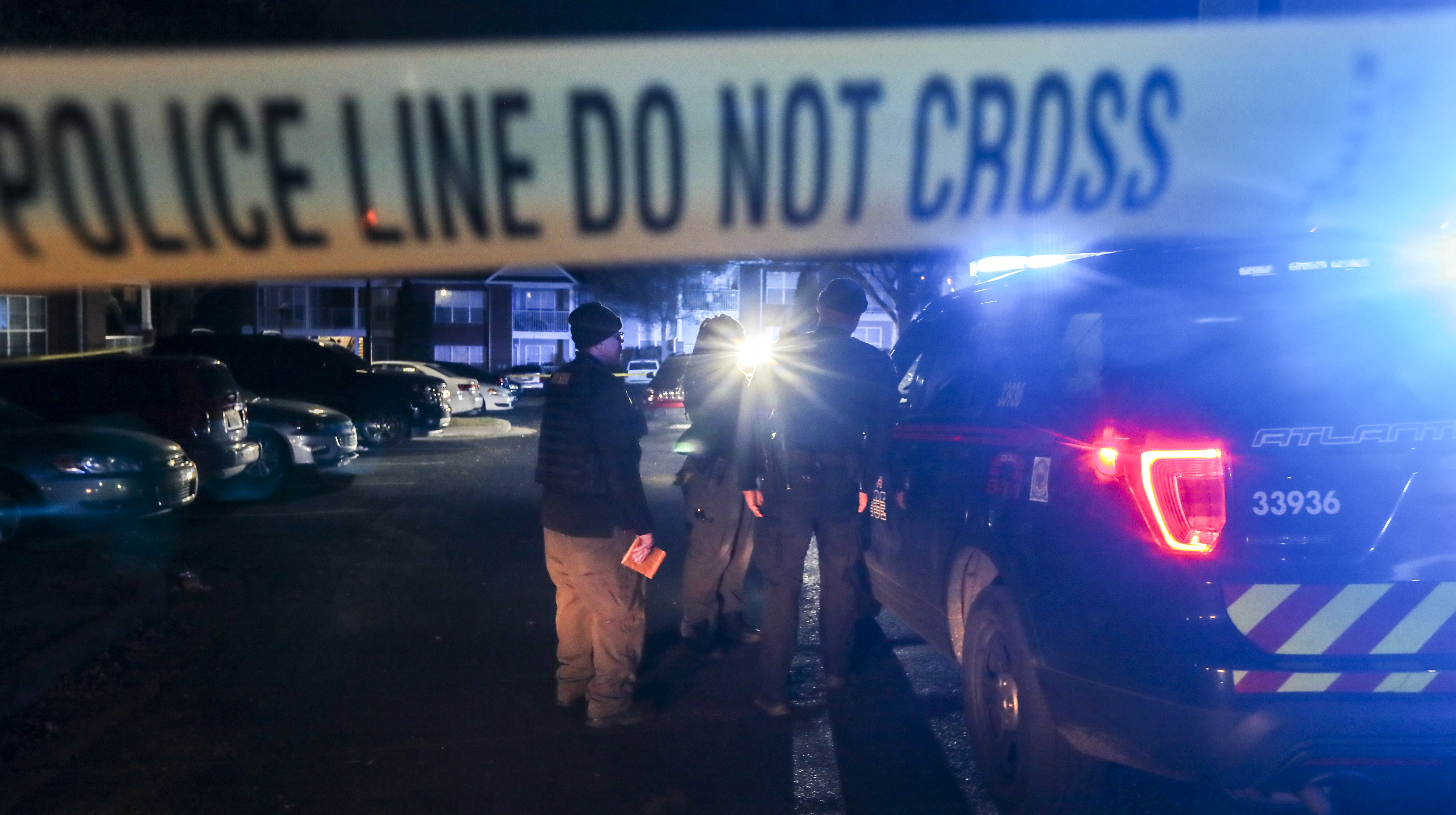 December 2, 2021 Atlanta: Atlanta police were on the scene collecting evidence and photographing a vehicle in the parking lot of The Villages at Carver located at 201 Moury Avenue SW in Atlanta on Thursday, Dec. 2, 2021. A shattered driverÕs window could be seen in the crime scene area. Atlanta police told the Atlanta Journal-Constitution that the scene stemmed from an individual walking into Grady Memorial hospital with a gunshot wound but did not provide any further details. (John Spink / John.Spink@ajc.com)