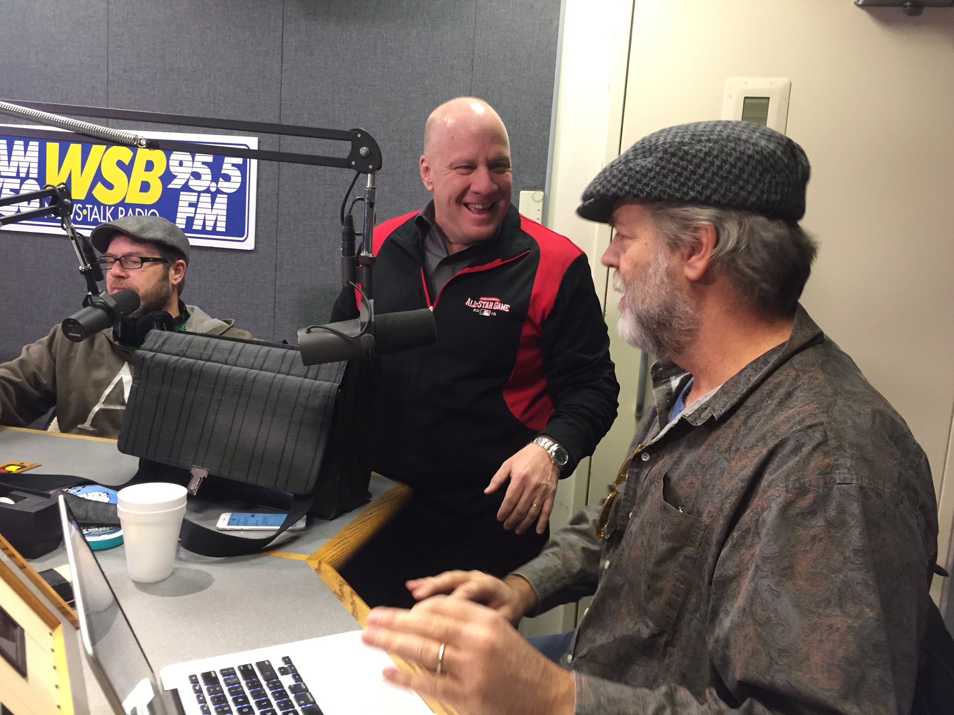Boss Pete Spriggs comes by to congratulate Von Haessler on his first weekday show. CREDIT: Rodney Ho/ rho@ajc.com