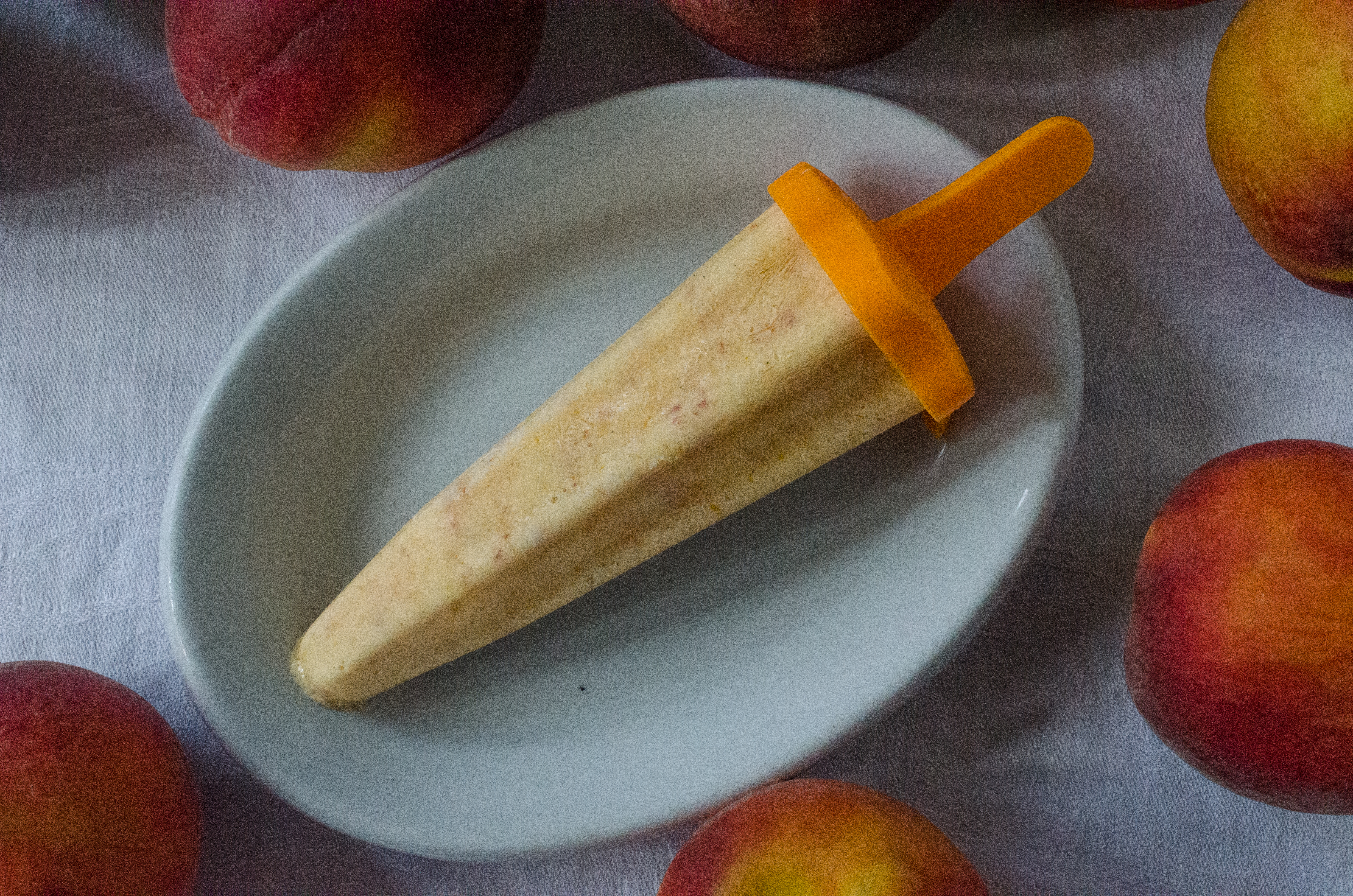 Enjoy a homemade frozen treat with Dreamy Peach Ice Pops. (Virginia Willis for The Atlanta Journal-Constitution)