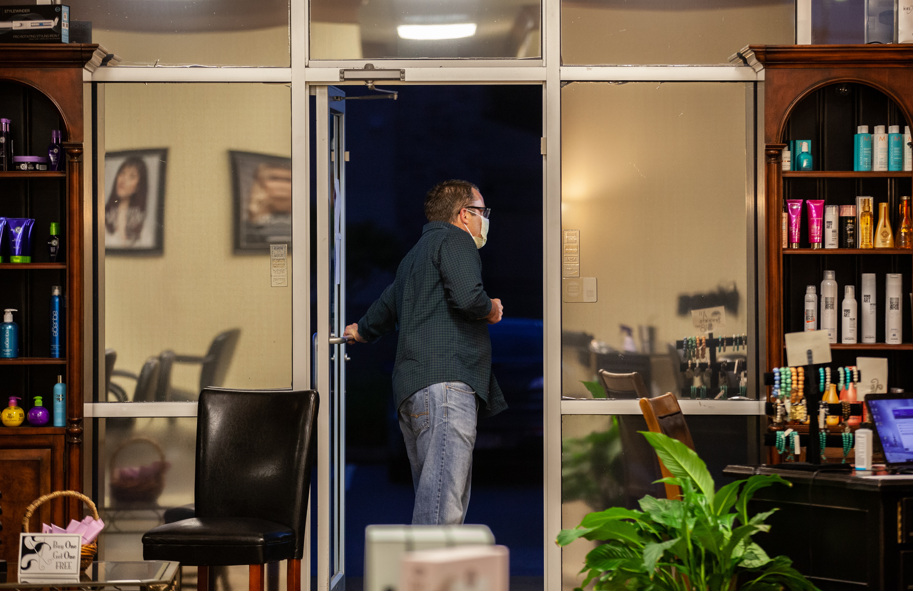 Stephen Richardson looks out for first customer of the day at Studio 151, Friday, April 24, 2020 in Dallas, Ga. Studio 151 is one of many businesses allowed to reopen after Gov. Kemp announced certain facilities can reopen to relieve strain on Georgia's economy. BRANDEN CAMP/SPECIAL