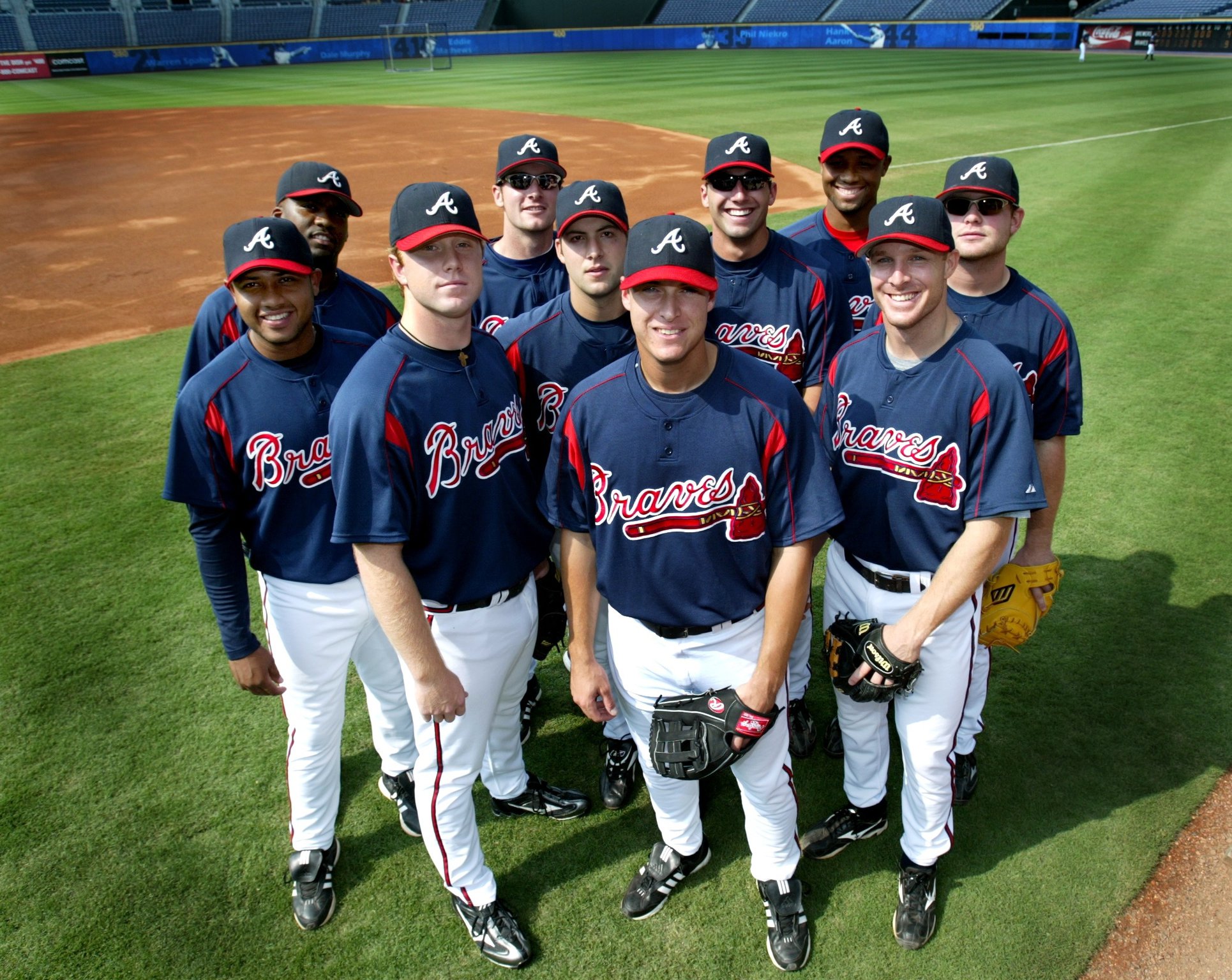 Atlanta Braves' Andruw Jones, right, is greeted by teammates